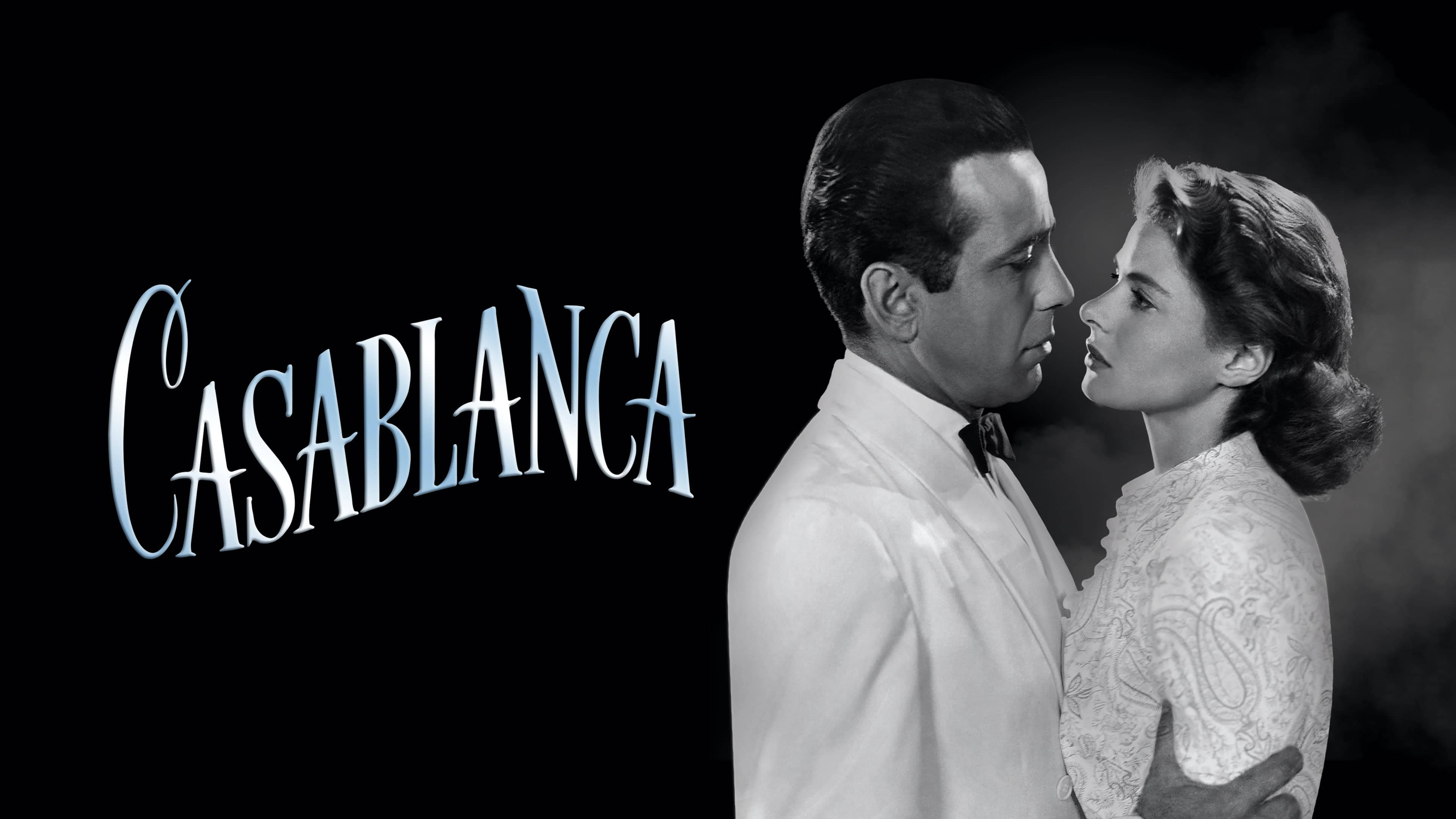 Casablanca 桌布 壁紙 — 一個黑白浪漫場景，一男一女在黑暗背景前專注地凝視對方，標題「Casablanca」以風格化字體呈現。