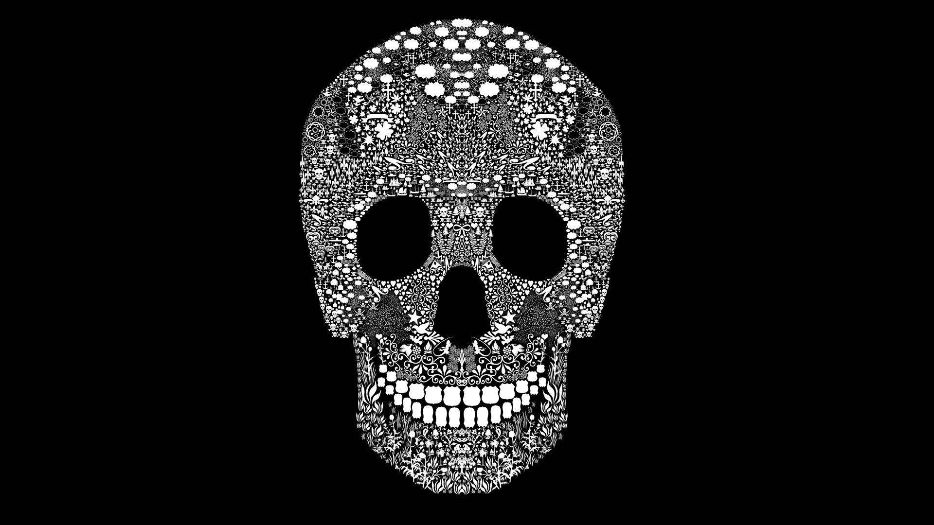 Sugar Skull 桌布 壁紙 — 一個黑白華麗的頭骨，充滿複雜的曼陀羅圖案，背景為純黑色。