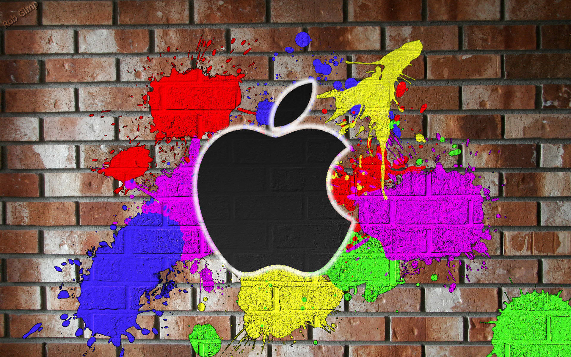 macOS 桌布 壁紙 — 一個黑色Apple標誌，在風化的磚牆上濺滿鮮豔的顏料。
