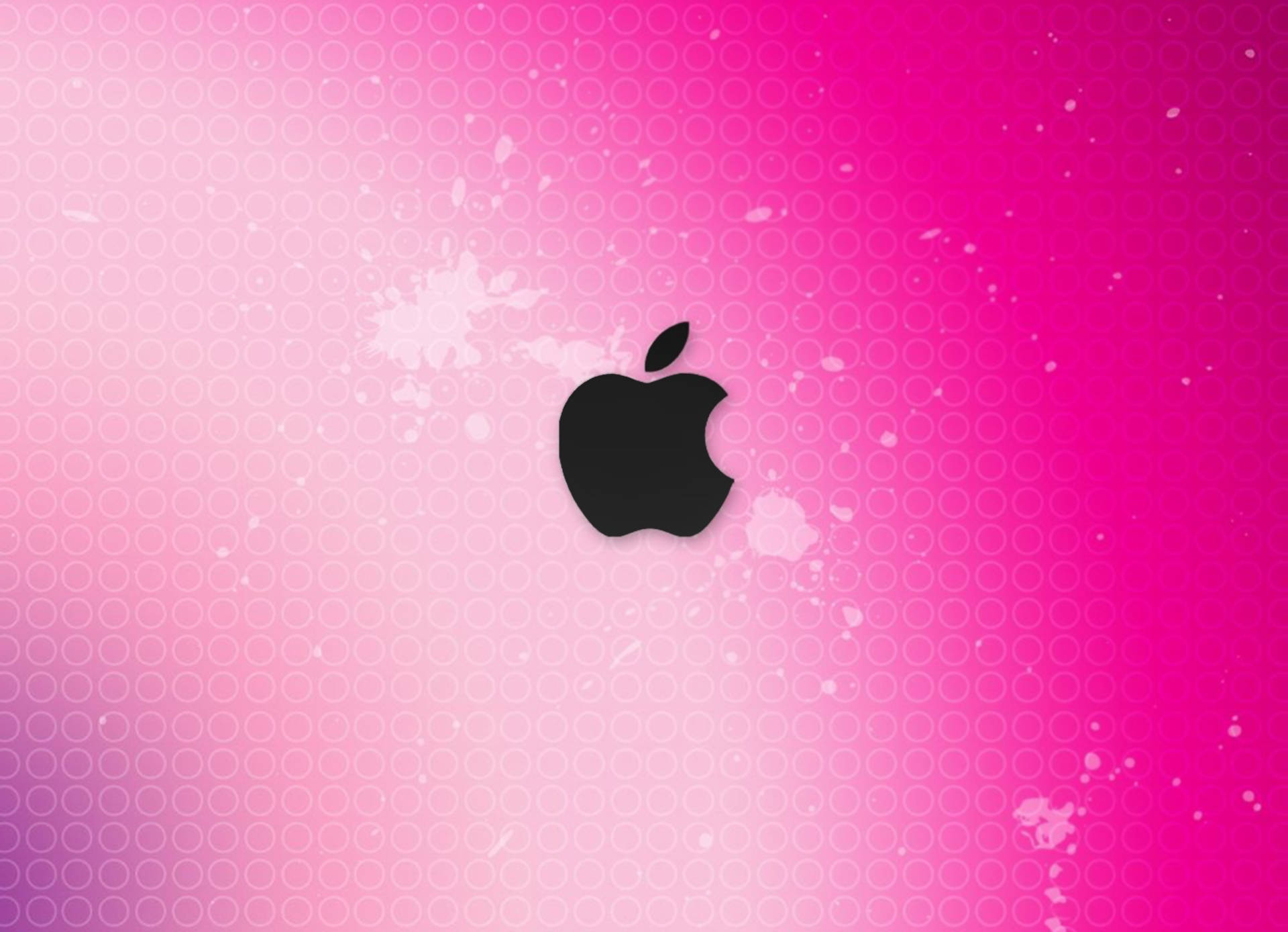可愛粉色動圖 桌布 壁紙 — 一個黑色Apple標誌置中於充滿活力的粉紅色漸變背景上，帶有微妙的圓形圖案和白色潑濺效果。
