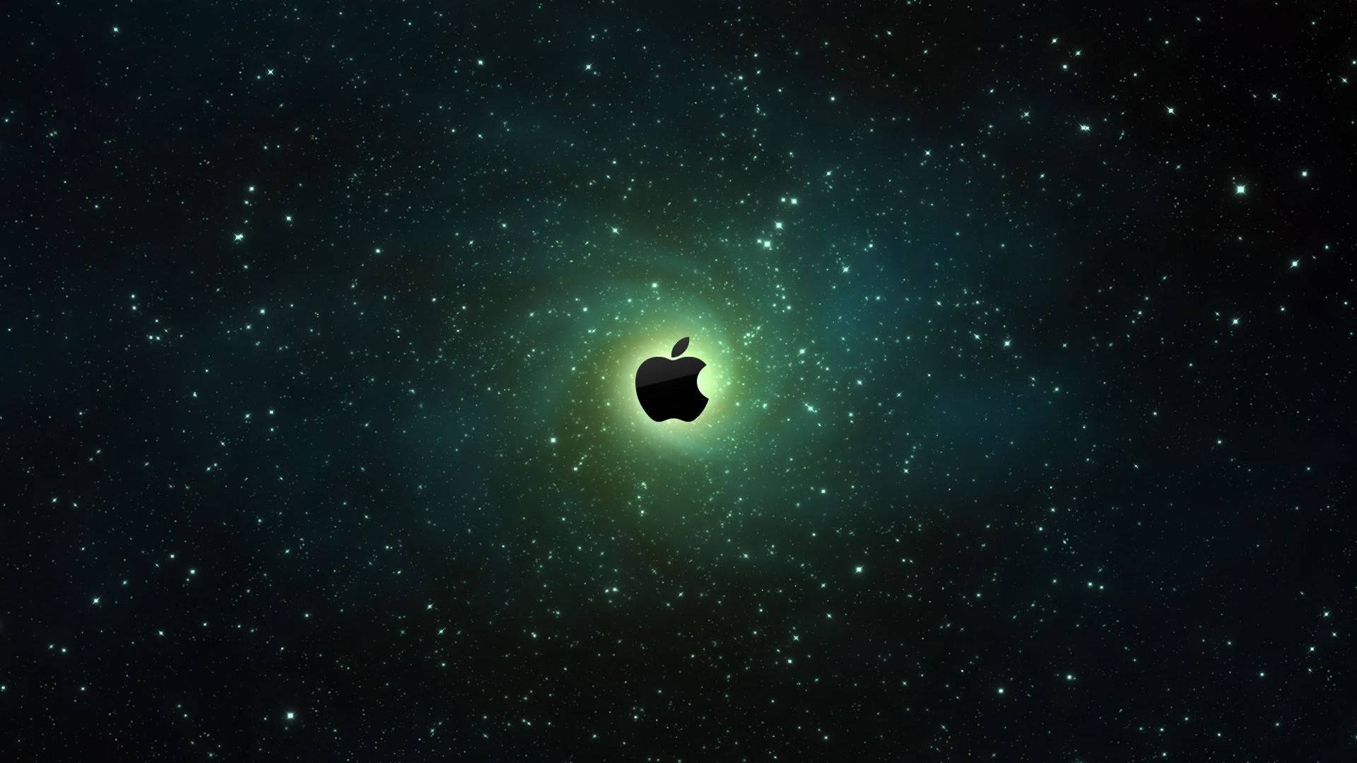 電腦 桌布 壁紙 — 一個黑色Apple標誌置中於星空之中，發光的綠色星雲向外輻射。