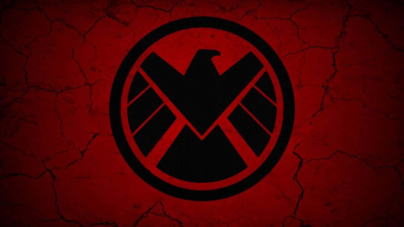Marvel Logo 桌布 壁紙 — 一個黑色SHIELD標誌居中於裂開的紅色牆壁上，帶有粗糙紋理背景。