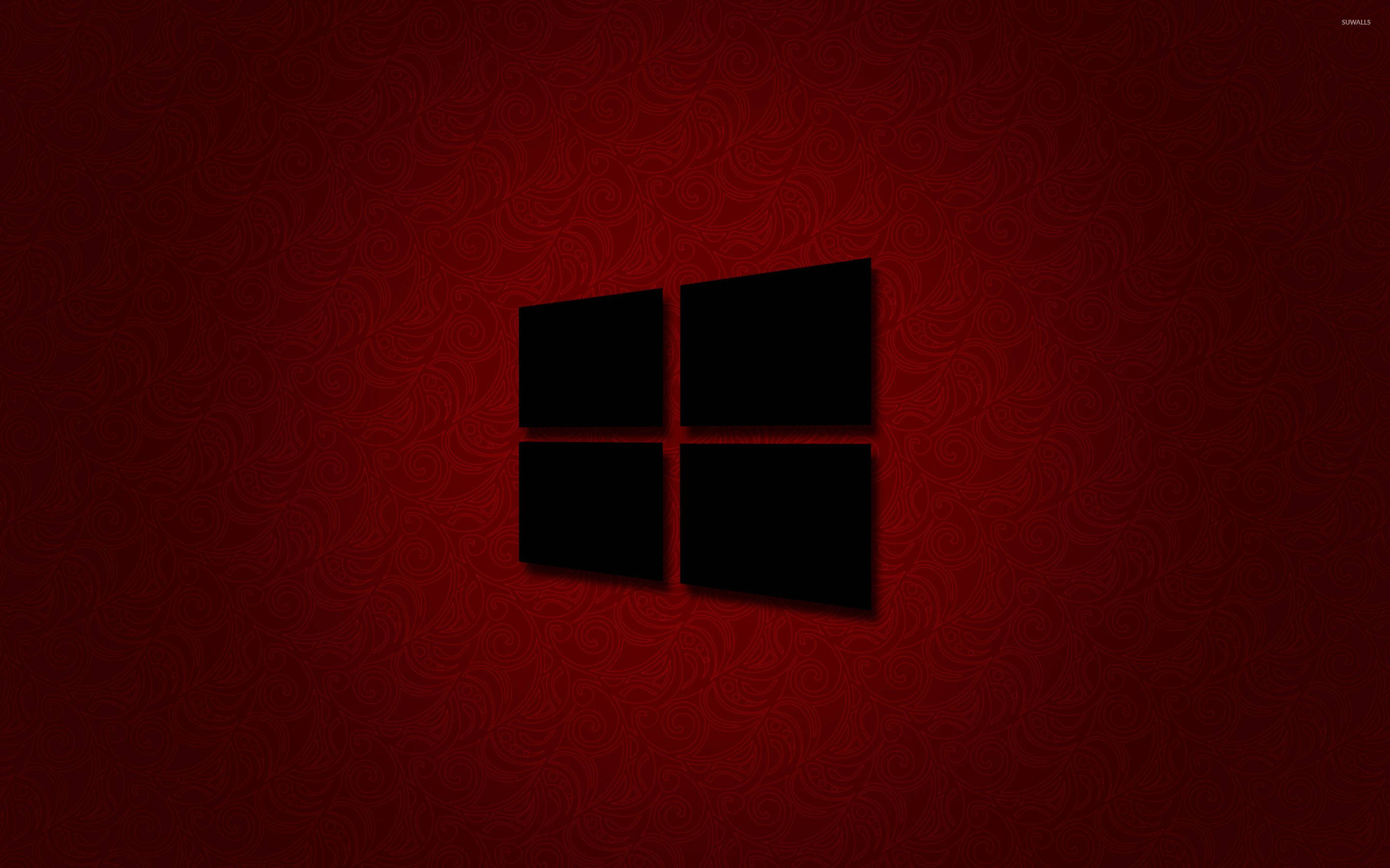 Windows 10 桌布 壁紙 — 一個黑色Windows標誌居中於帶有微妙漩渦圖案的豐富紅色背景上。
