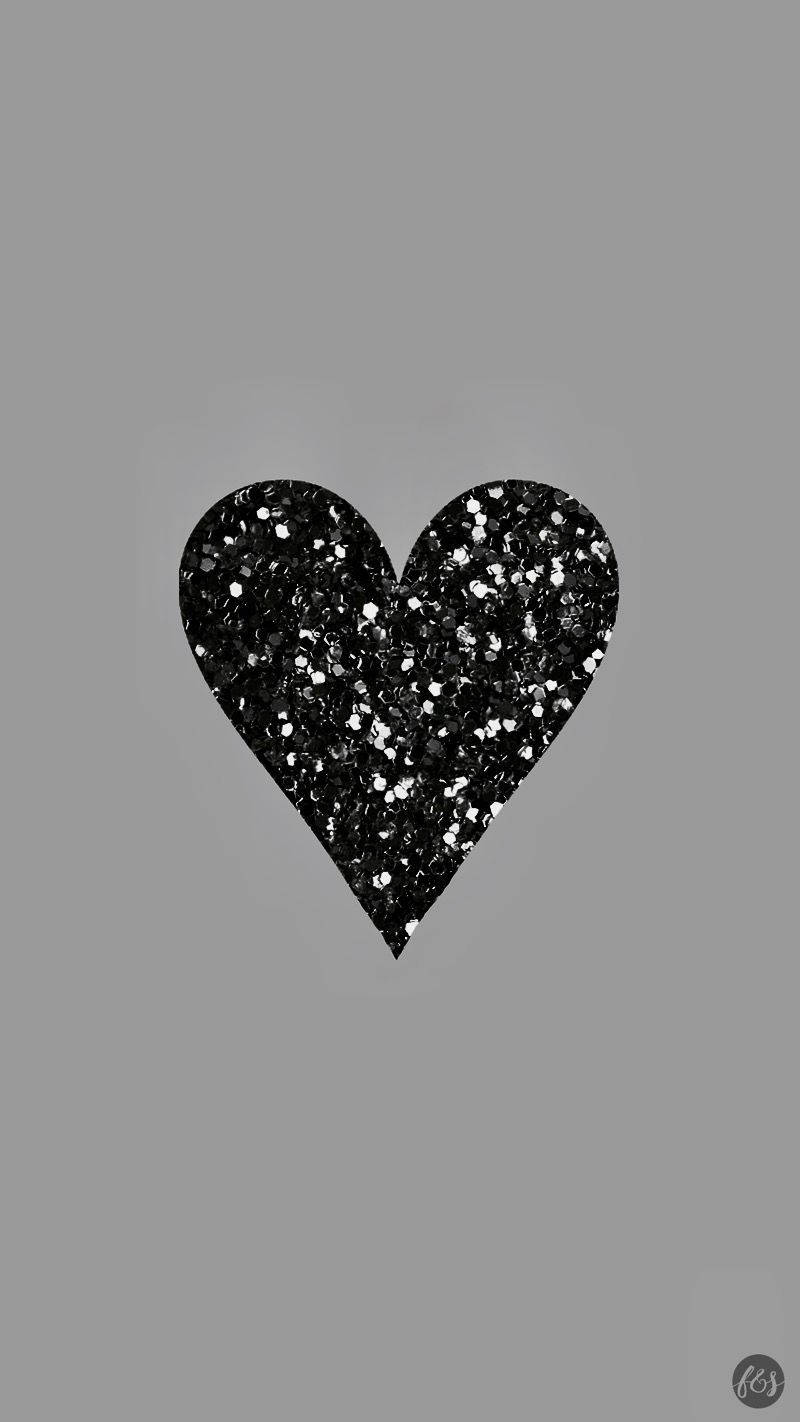 Heart 桌布 壁紙 — 一個黑色亮粉心形，帶有銀色閃光，居中在純灰色背景上。