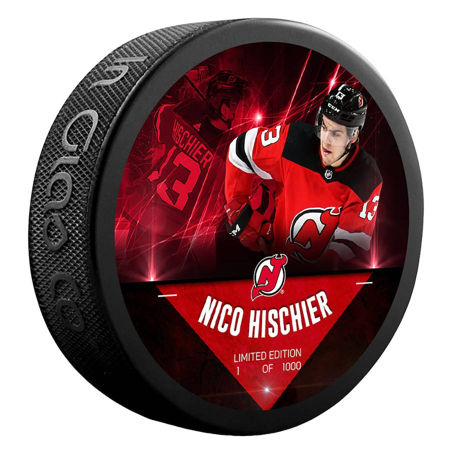 hockey 桌布 壁紙 — 一個黑色冰球，上面有NHL球員Nico Hischier動態的紅色圖案，並帶有他的名字和限量版編號。