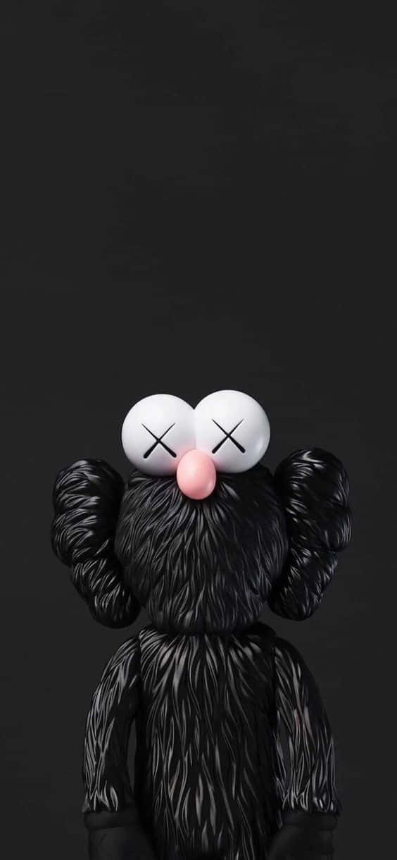 kaws pc 桌布 壁紙 — 一個黑色毛茸茸的KAWS角色，有白色眼睛和粉紅色鼻子，在純黑色背景上直視前方。