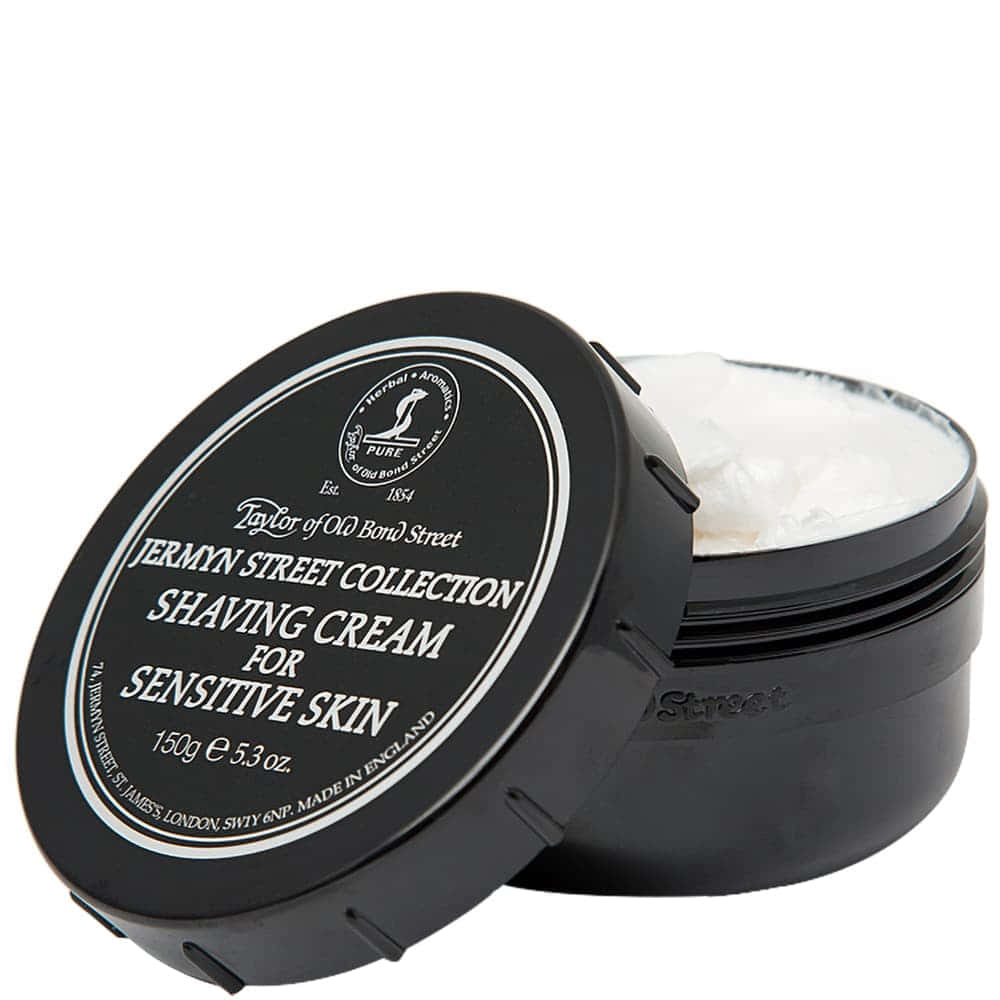 Shaving Cream 桌布 壁紙 — 一個黑色罐裝的Taylor of Old Bond Street敏感肌膚刮鬍膏，蓋子微微打開，露出乳白色內容物。