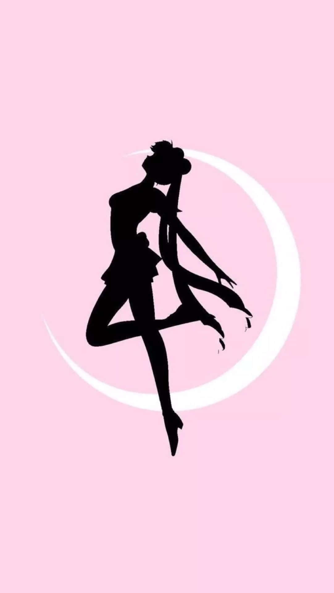 Aesthetic Sailor Moon 桌布 壁紙 — 一個黑色芭蕾舞者剪影，正在半空中跳躍，背景是柔和的粉紅色，帶有白色新月。