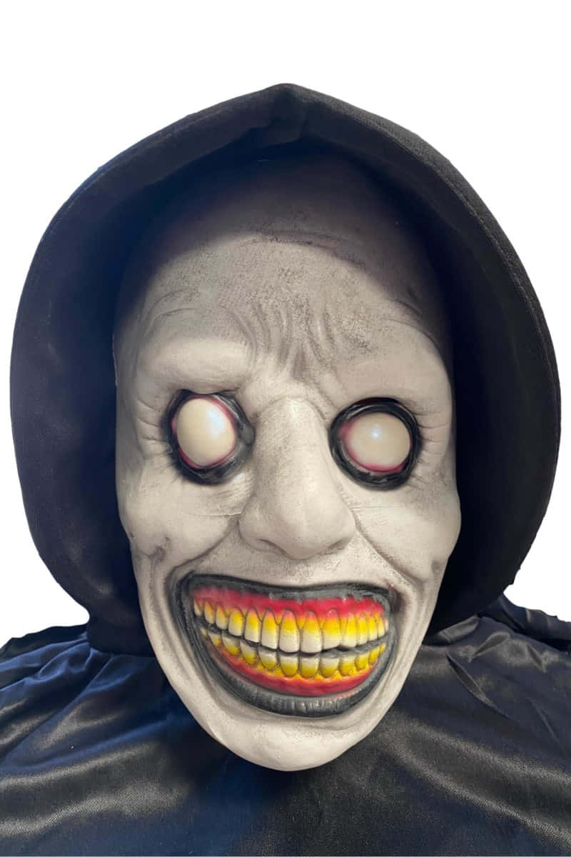 Creepy Halloween 桌布 壁紙 — 一個黑色頭罩下，咧嘴露出滿口黃牙、白色眼球突出的恐怖面具。