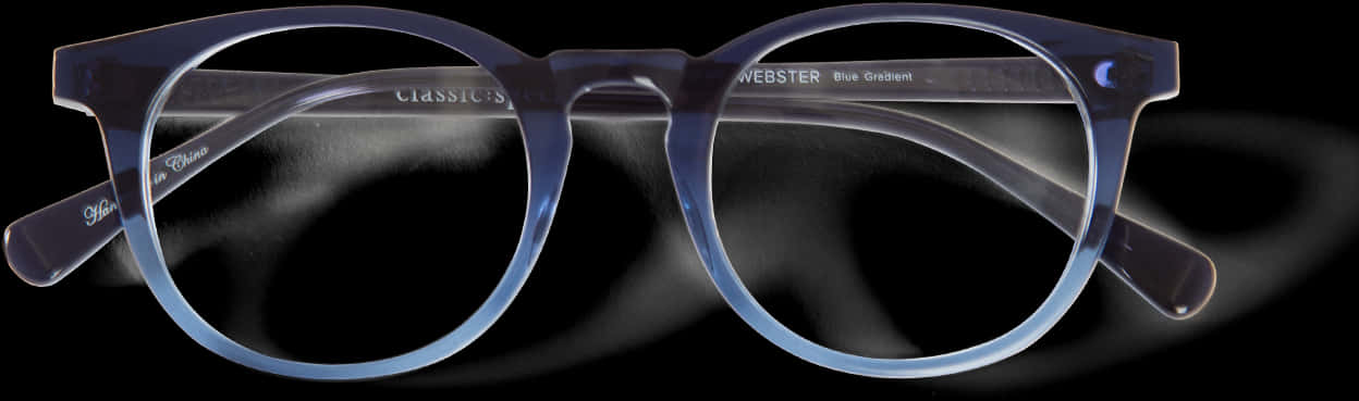 Accessories 桌布 壁紙 — 一副半透明藍色漸變眼鏡，帶有 'WEBSTER' 品牌標誌，靠在深色煙霧背景上。