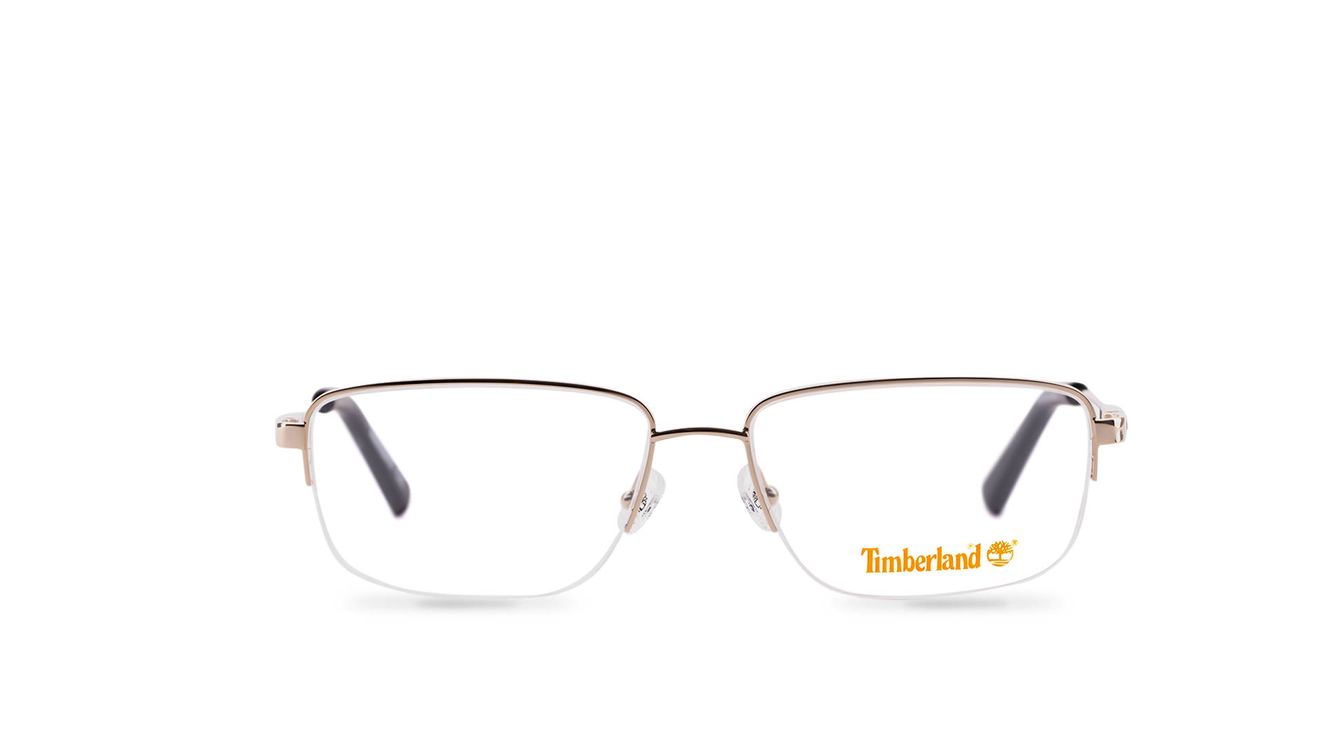 品牌 桌布 壁紙 — 一副金色邊框的Timberland眼鏡，搭配透明鏡片和深色鏡腿尖端，展示在潔白背景上。