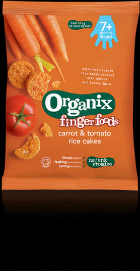 蛋糕 桌布 壁紙 — 一包鮮豔橙色的Organix手指食物胡蘿蔔番茄米餅，配有新鮮蔬菜和藍色7+年齡標誌。