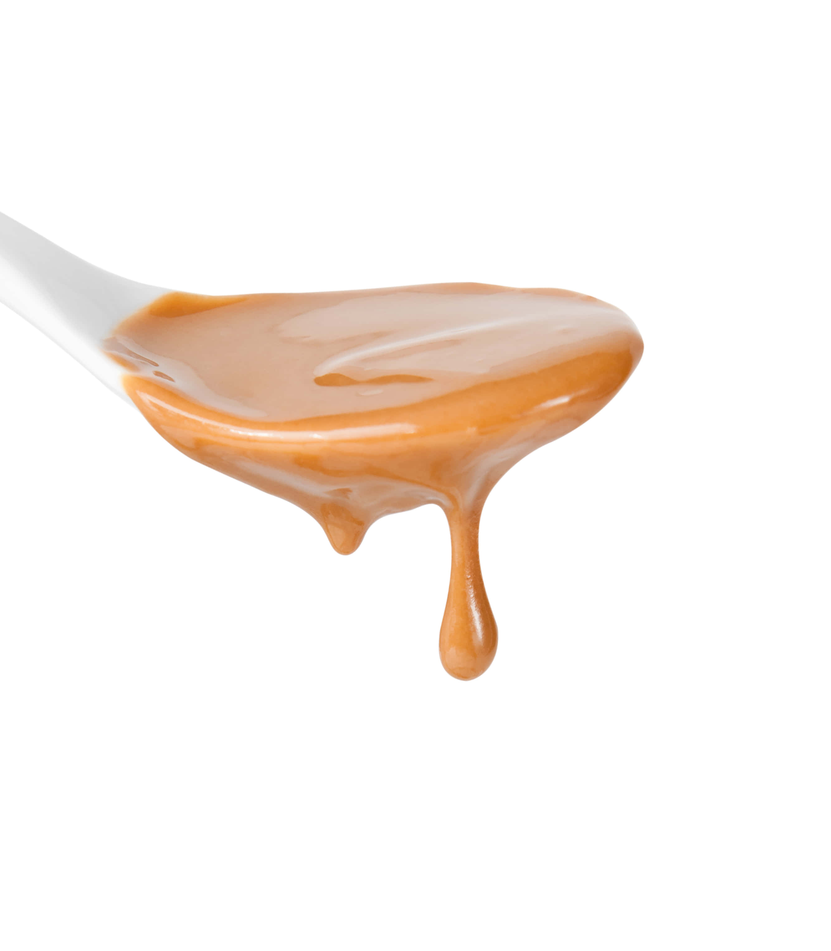 Brown Caramel 桌布 壁紙 — 一匙亮澤金黃色的焦糖醬在純白背景上緩緩滴落。