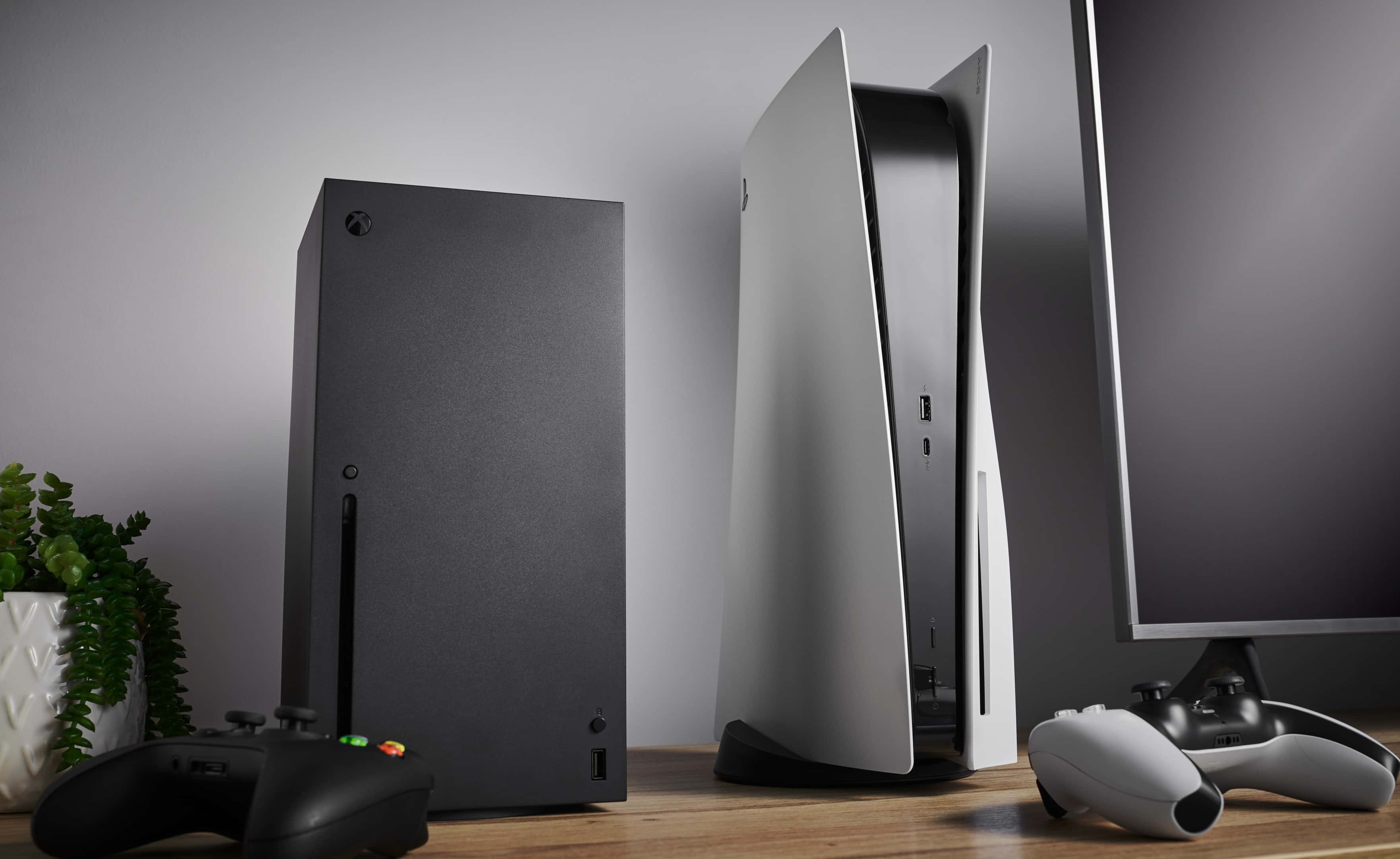 一台PS4和一台PS4 Pro放在桌上 壁紙