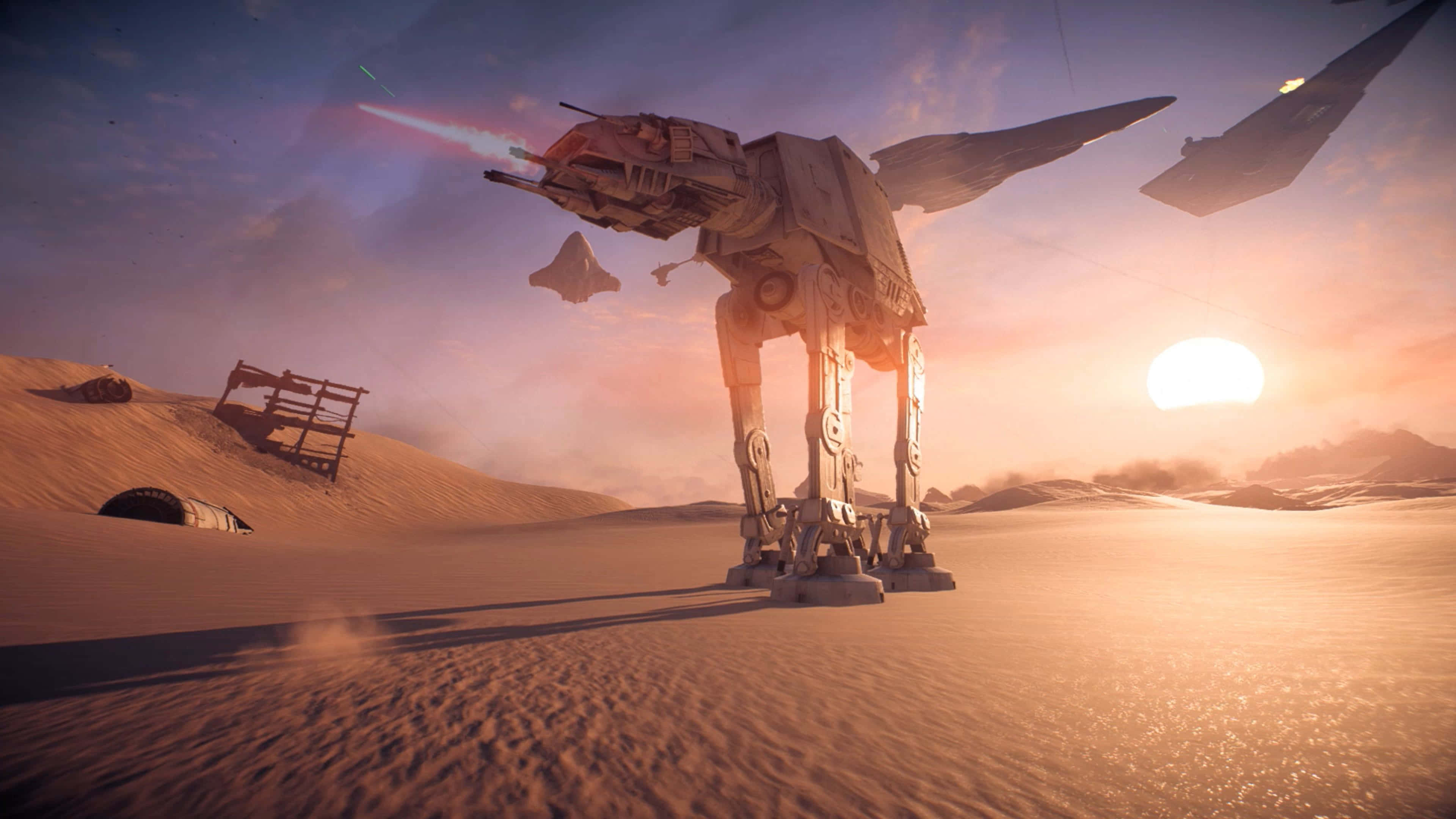 The Battle Of Jakku 桌布 壁紙 — 一台巨大的AT-AT步行機穿越沙漠景觀，同時發射雷射，星際戰鬥機在 vibrant 的日落期間飛越頭頂。