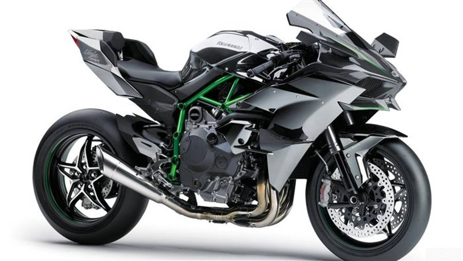 機車 桌布 壁紙 — 一台時尚的銀綠色Kawasaki運動摩托車，帶有外露引擎和空氣動力學整流罩。