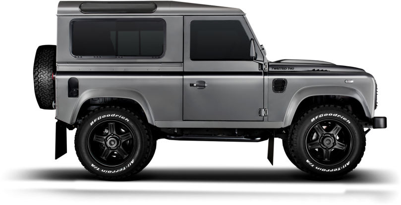 荒原路華 桌布 壁紙 — 一台時尚的銀色 Land Rover Defender 側面站立在純黑色背景前，展示其堅固的輪胎和經典的方正設計。
