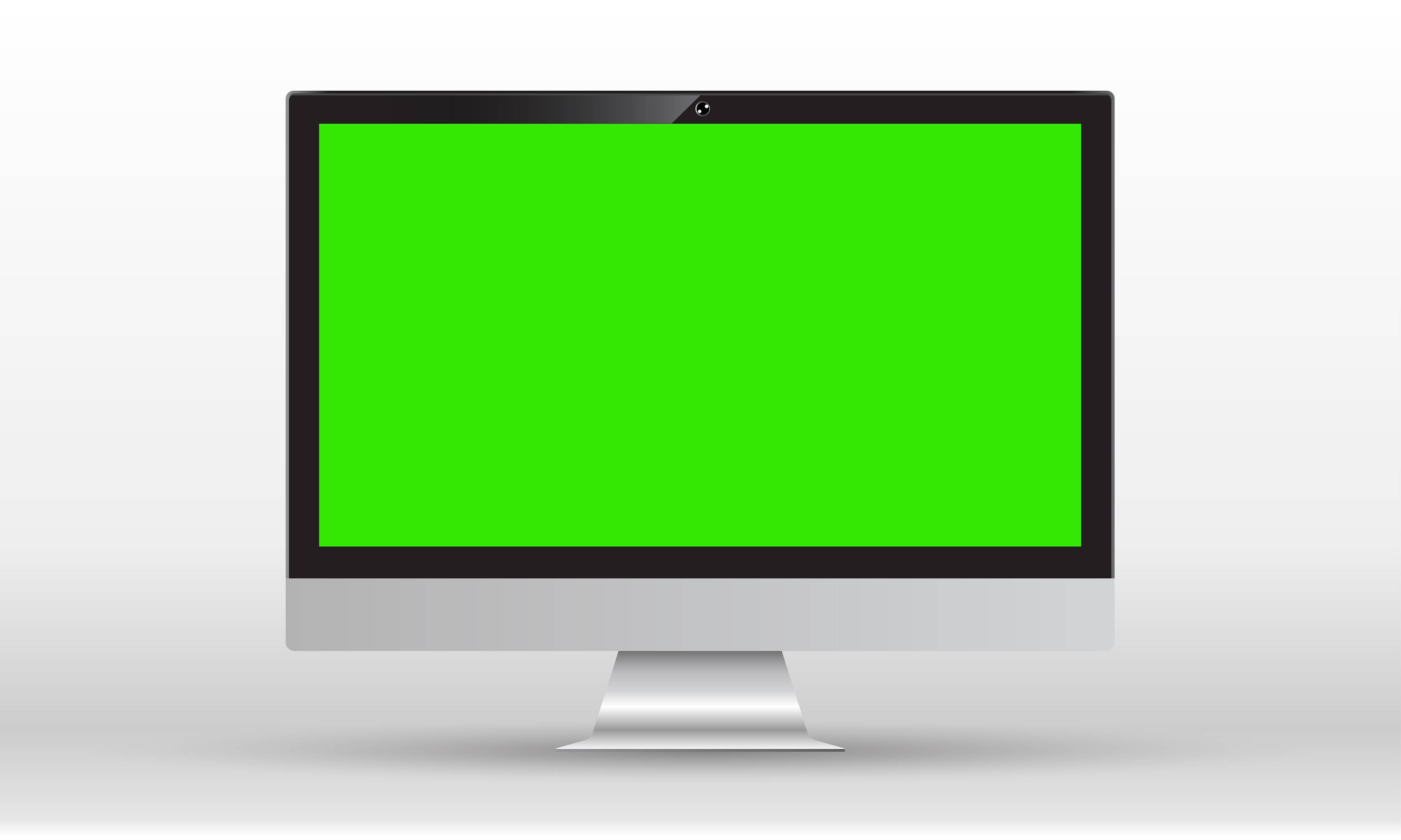 Green Screen 桌布 壁紙 — 一台時尚的銀色一體式桌上型電腦，配備亮綠色螢幕和網路攝影機，置於潔白背景中央。