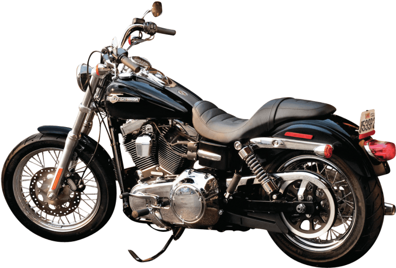 哈雷戴維森 桌布 壁紙 — 一台時尚的黑色Harley-Davidson摩托車，帶有鍍鉻裝飾和鋼絲輪圈，孤立地立在純黑色背景上。