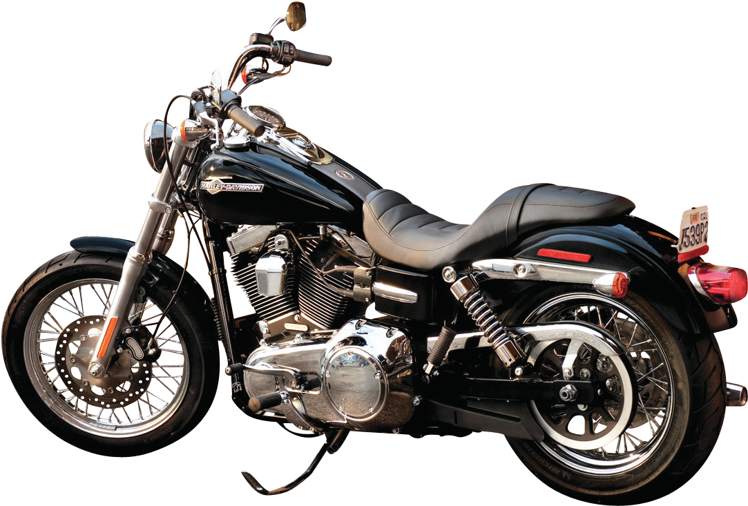 哈雷戴維森 桌布 壁紙 — 一台時尚的黑色Harley-Davidson機車，帶有鍍鉻裝飾和皮革座椅，孤立地立在純黑色背景上。