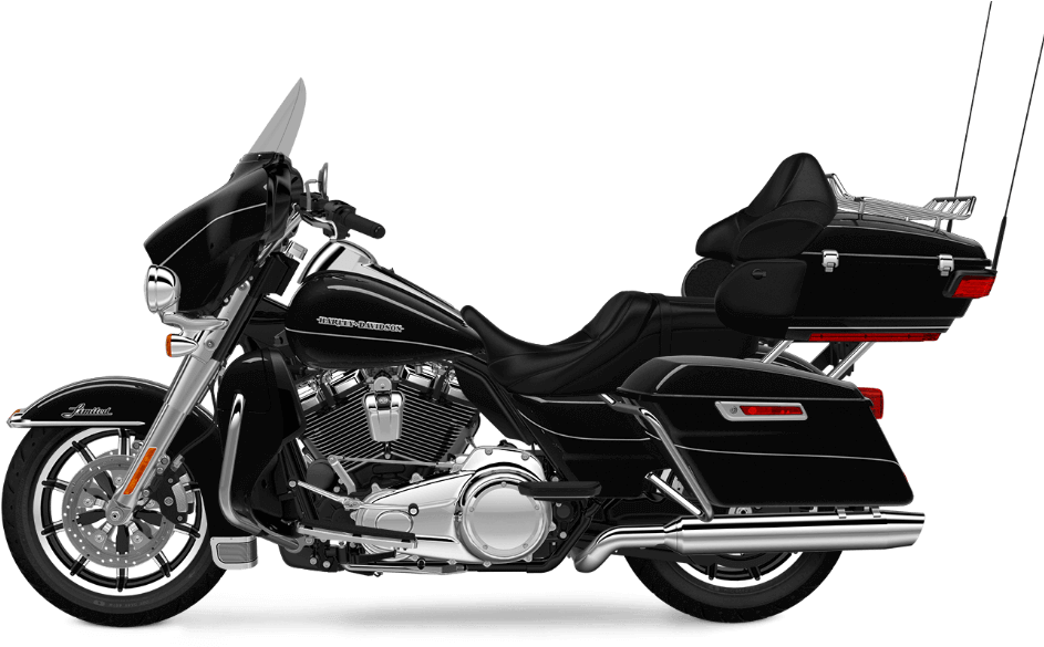 哈雷戴維森 桌布 壁紙 — 一台時尚黑色Harley-Davidson旅行機車，帶有鍍鉻裝飾和側袋，孤立在純黑色背景上。