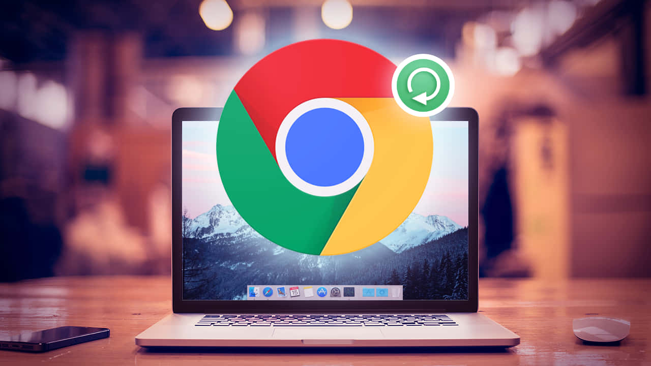 筆記型電腦帶有 Chrome 瀏覽器圖示和重新整理符號，置於山脈桌布上。 — Valorant Logo 壁紙