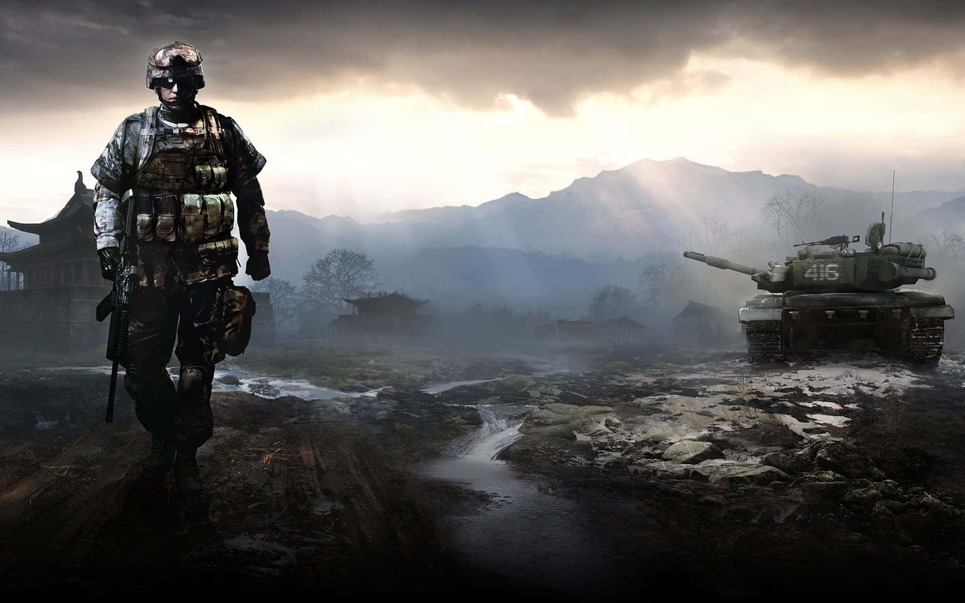 War Games 桌布 壁紙 — 一名全副武裝的士兵走過霧氣瀰漫的戰場，附近有一輛坦克在戲劇性的多雲天空下休息。