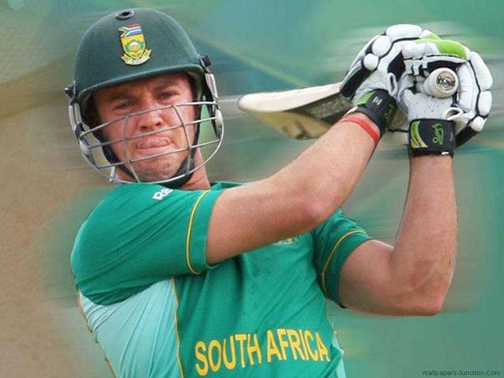 Ab De Villiers 桌布 壁紙 — 一名南非板球運動員身穿綠色球衣，在比賽中專注揮棒。