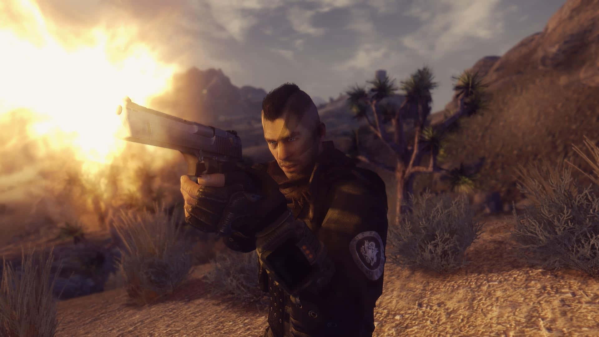 Soap Mactavish 桌布 壁紙 — 一名士兵在沙漠景觀中發射手槍，明亮的槍口閃光照亮岩石地形和約書亞樹。