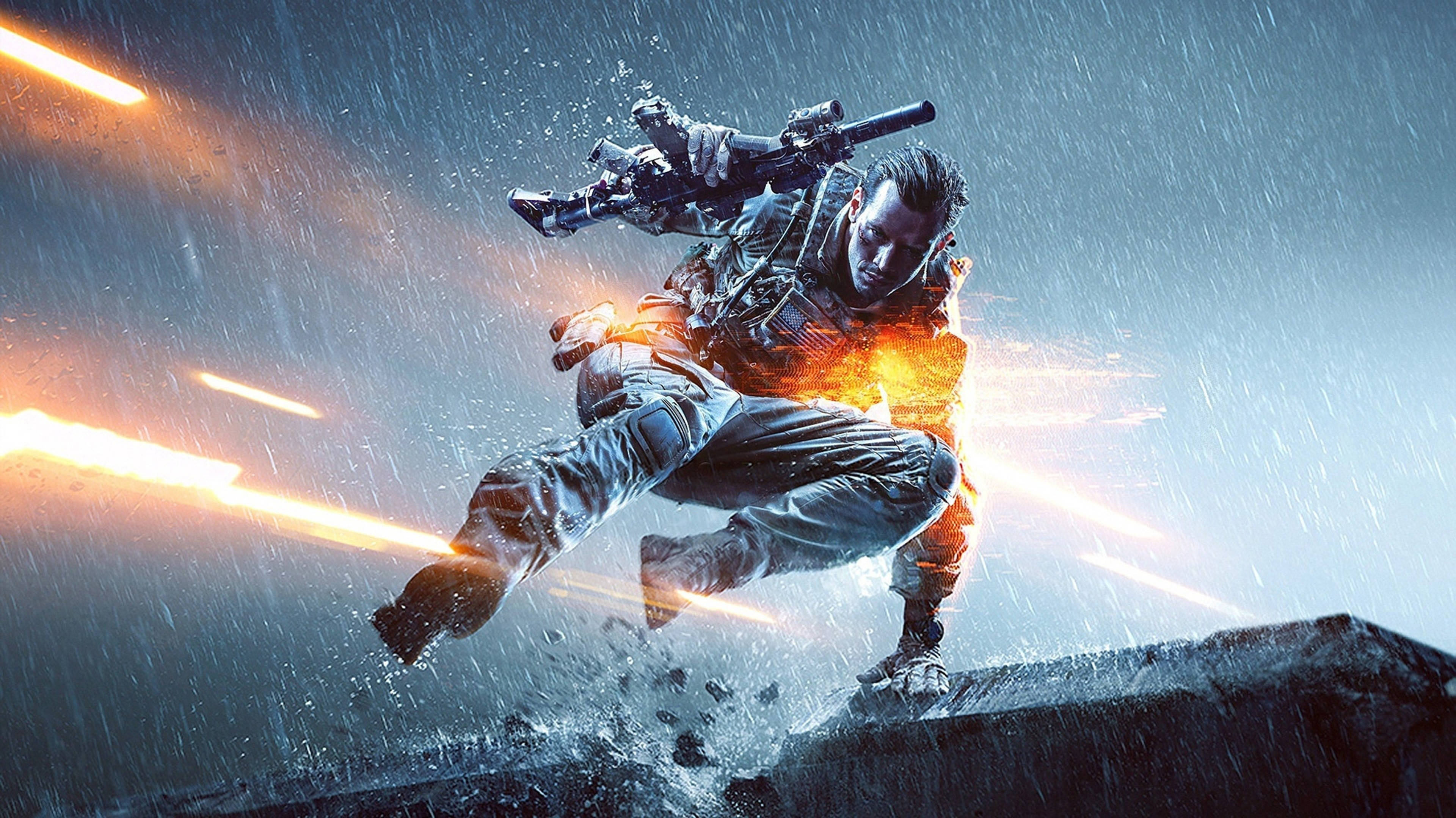 PC 遊戲 桌布 壁紙 — 一名士兵在雨中躍起，熾熱的爆炸照亮了他的戰術裝備和濕漉漉的城市戰場。