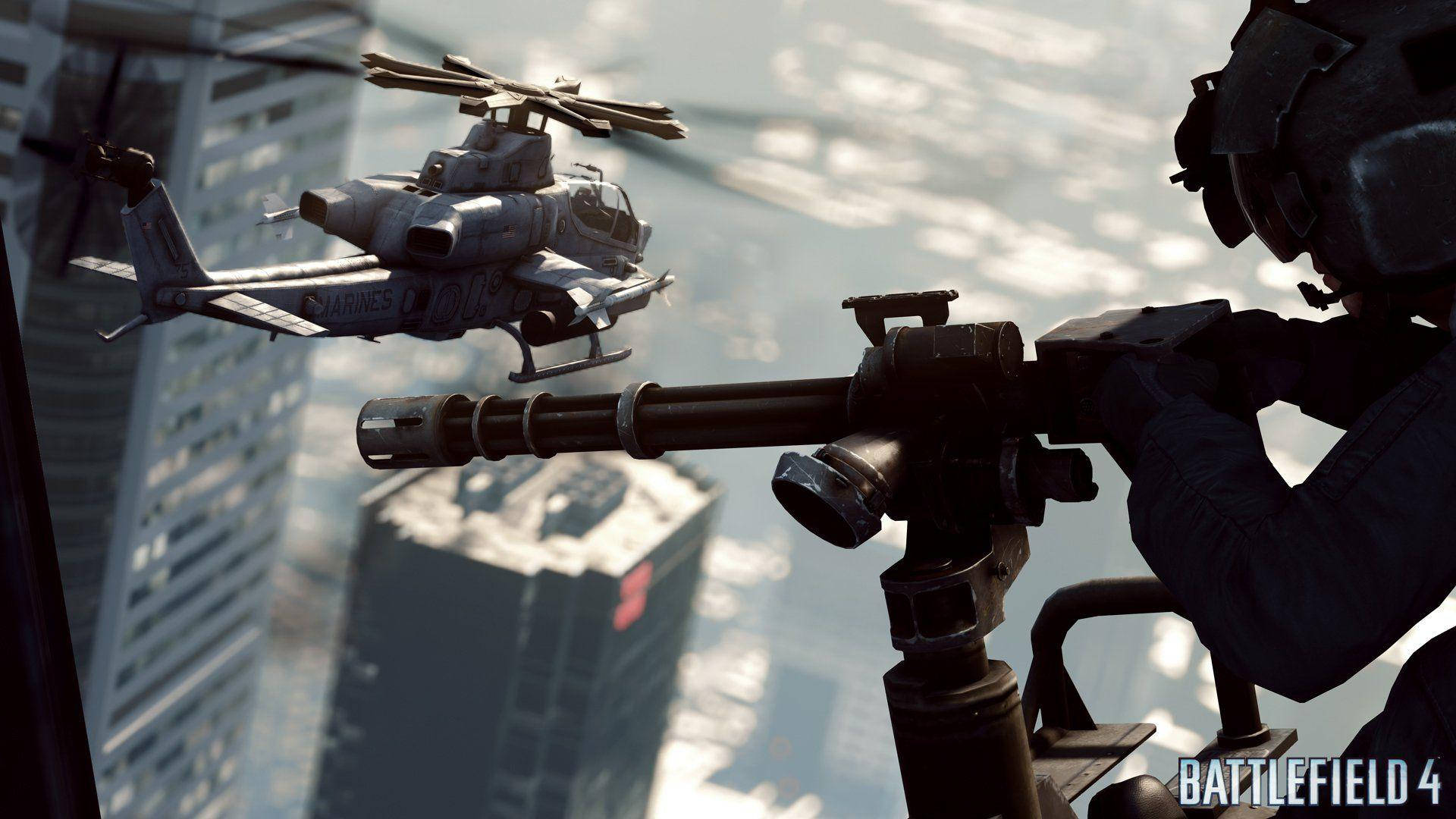 Helicopter 桌布 壁紙 — 一名士兵從高處瞄準重型機槍，一架海軍陸戰隊直升機飛過高聳的城市摩天大樓。