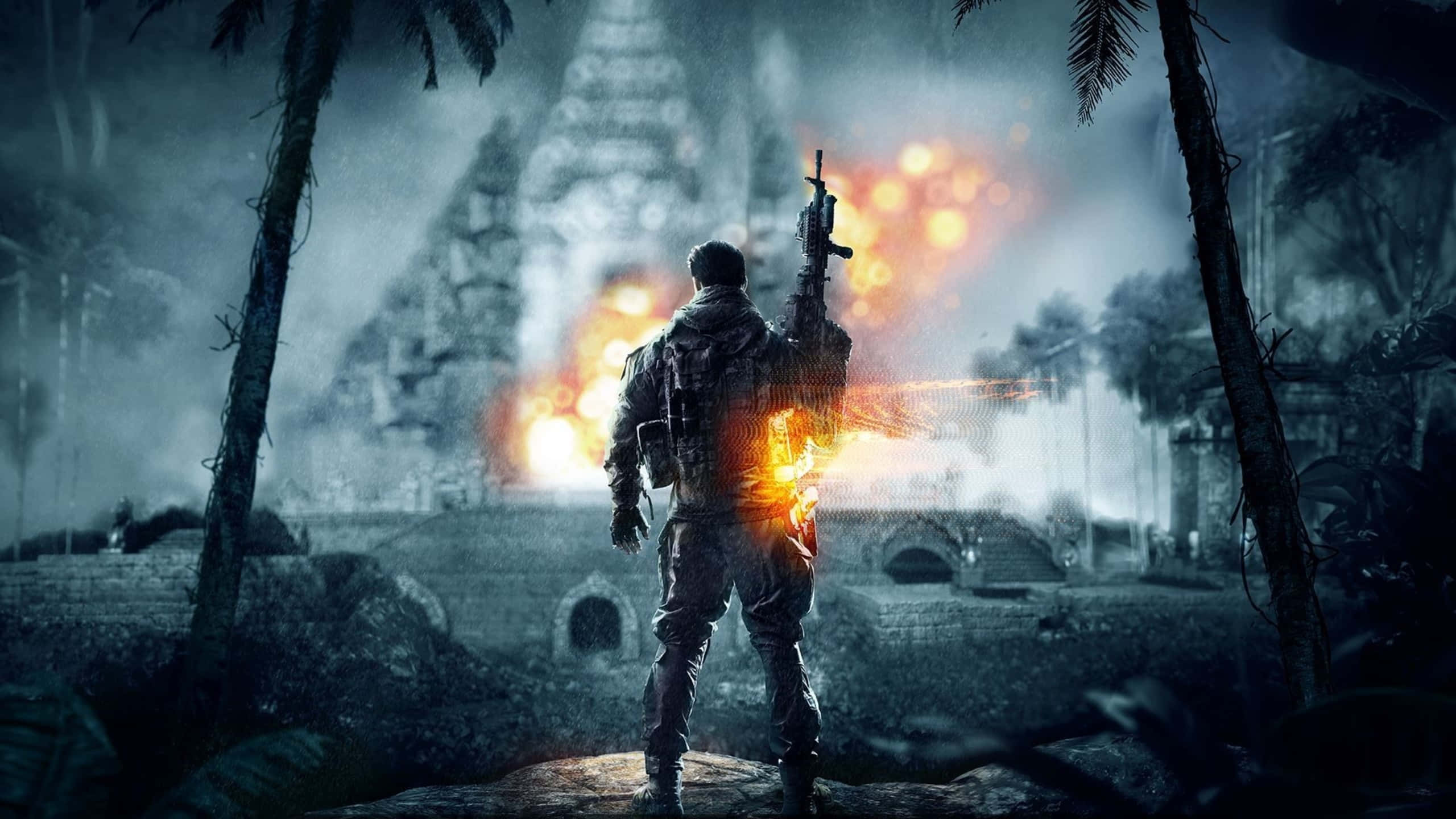 1440p Battlefield 1 桌布 壁紙 — 一名士兵站在叢林寺廟廢墟中，身後在黑暗的天空下爆發熾熱的爆炸。
