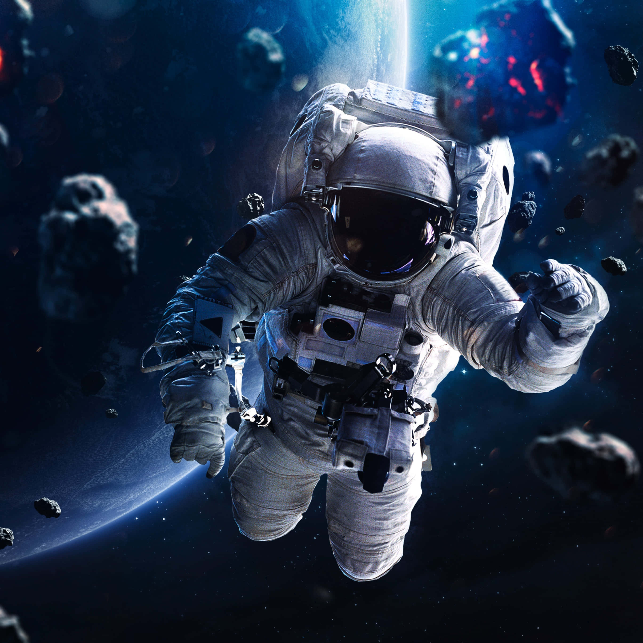 Amazing Astronaut 桌布 壁紙 — 一名太空人在零重力下漂浮於浮動的小行星之間，背景有一顆發光的行星。