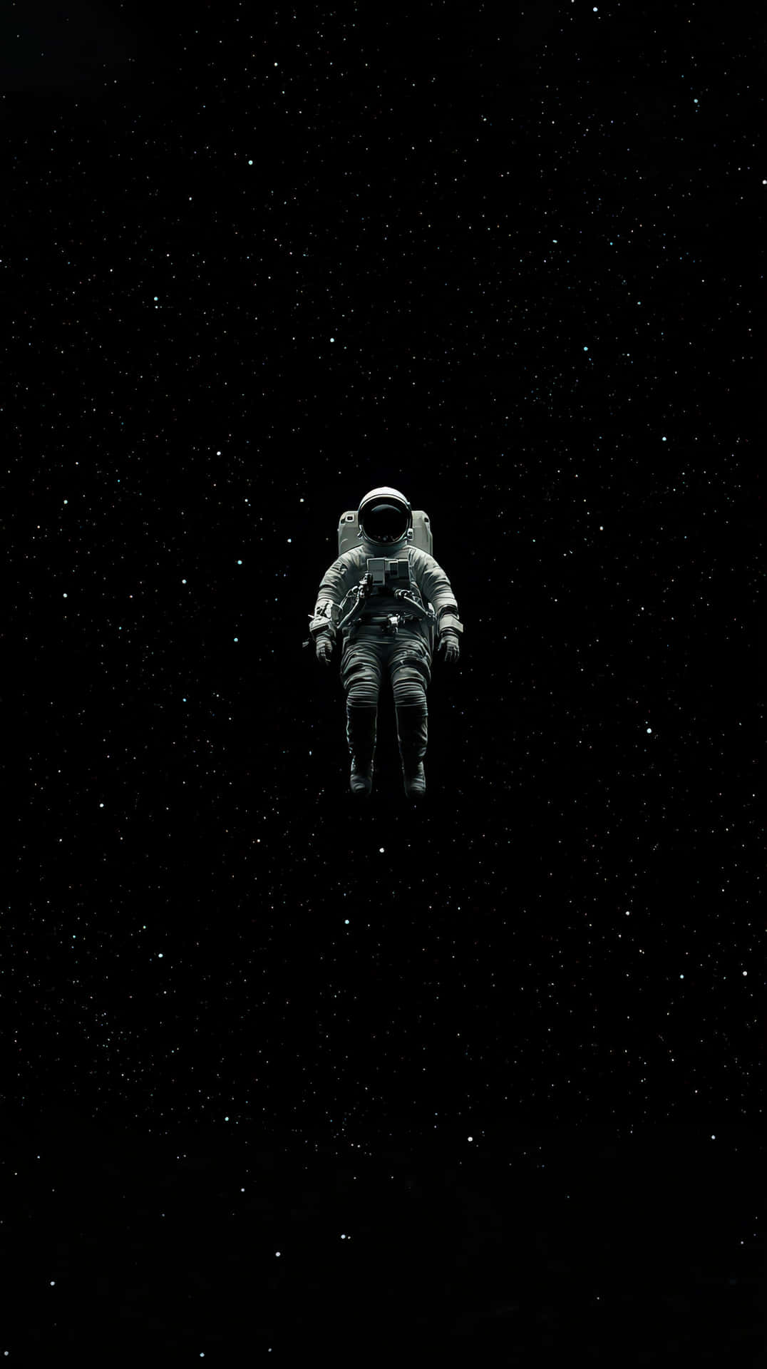 Solitary astronaut floating in the vast emptiness of deep space surrounded by stars 壁紙 — 一名孤獨的太空人在浩瀚星空中失重漂浮。