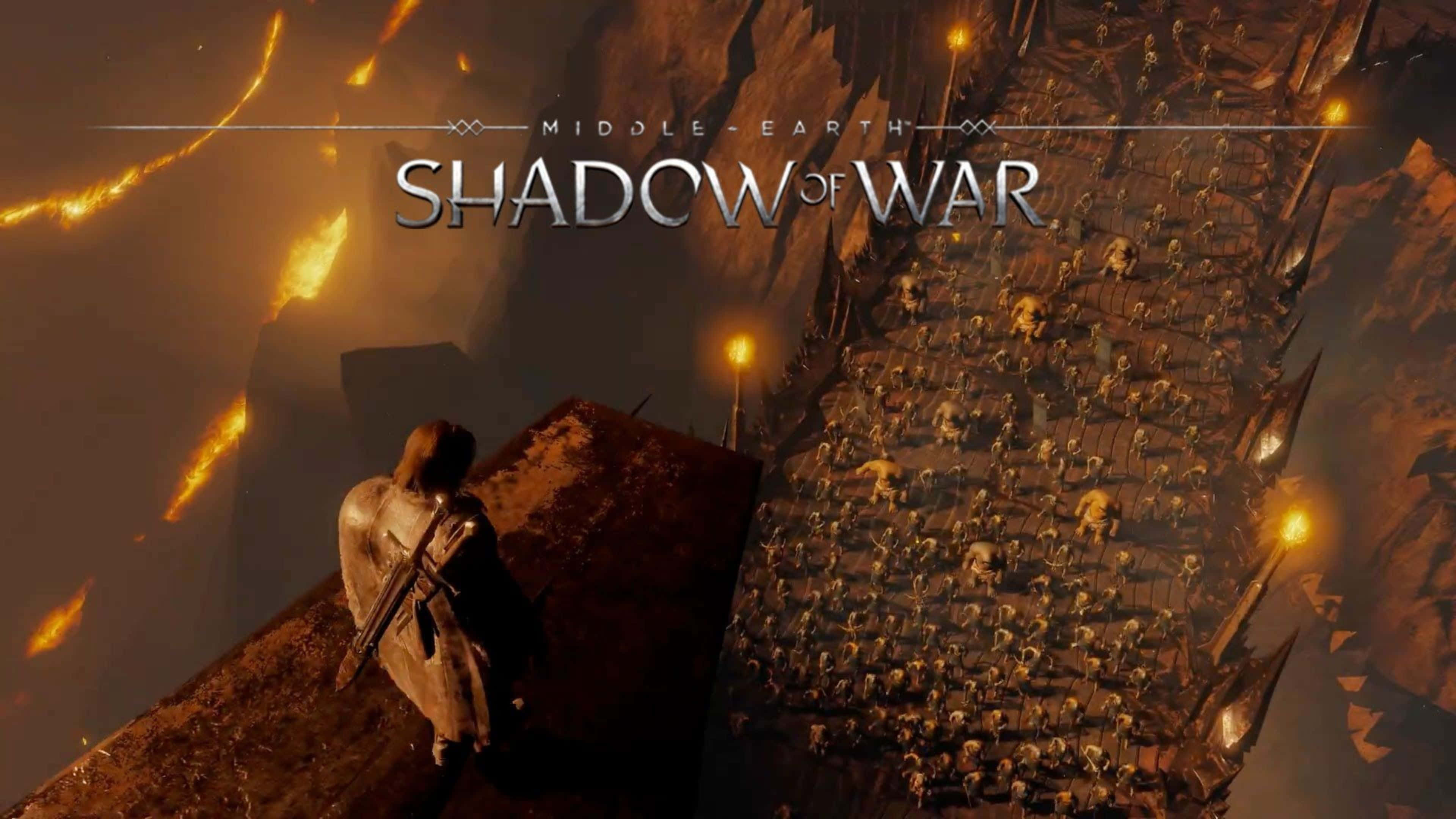 4K Shadow Of War 桌布 壁紙 — 一名孤獨的戰士站在懸崖上，俯瞰下方在火紅天空下的龐大獸人軍隊。