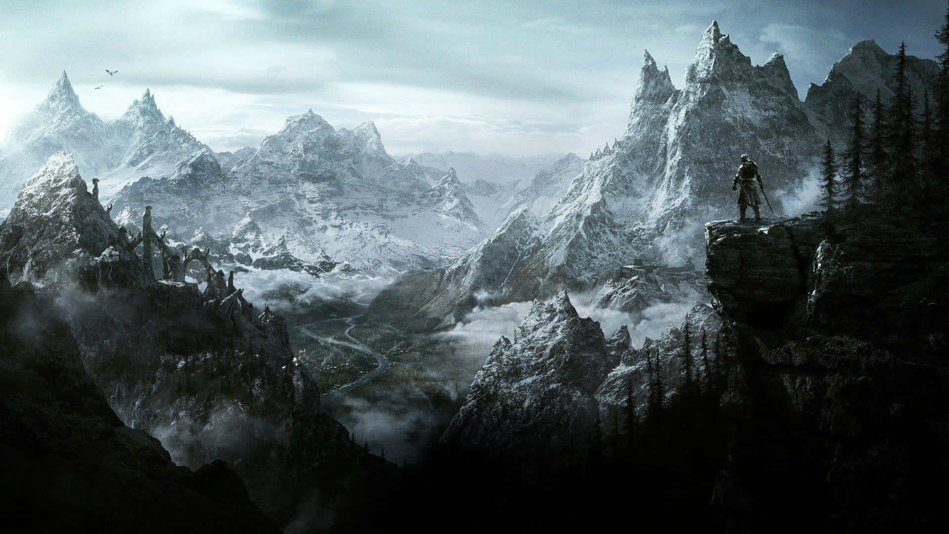 The Elder Scrolls V Skyrim 桌布 壁紙 — 一名孤獨的戰士站在白雪皚皚的山頂上，俯瞰著廣闊的霧氣瀰漫的山谷，其中有鋸齒狀的山峰和古老的廢墟。