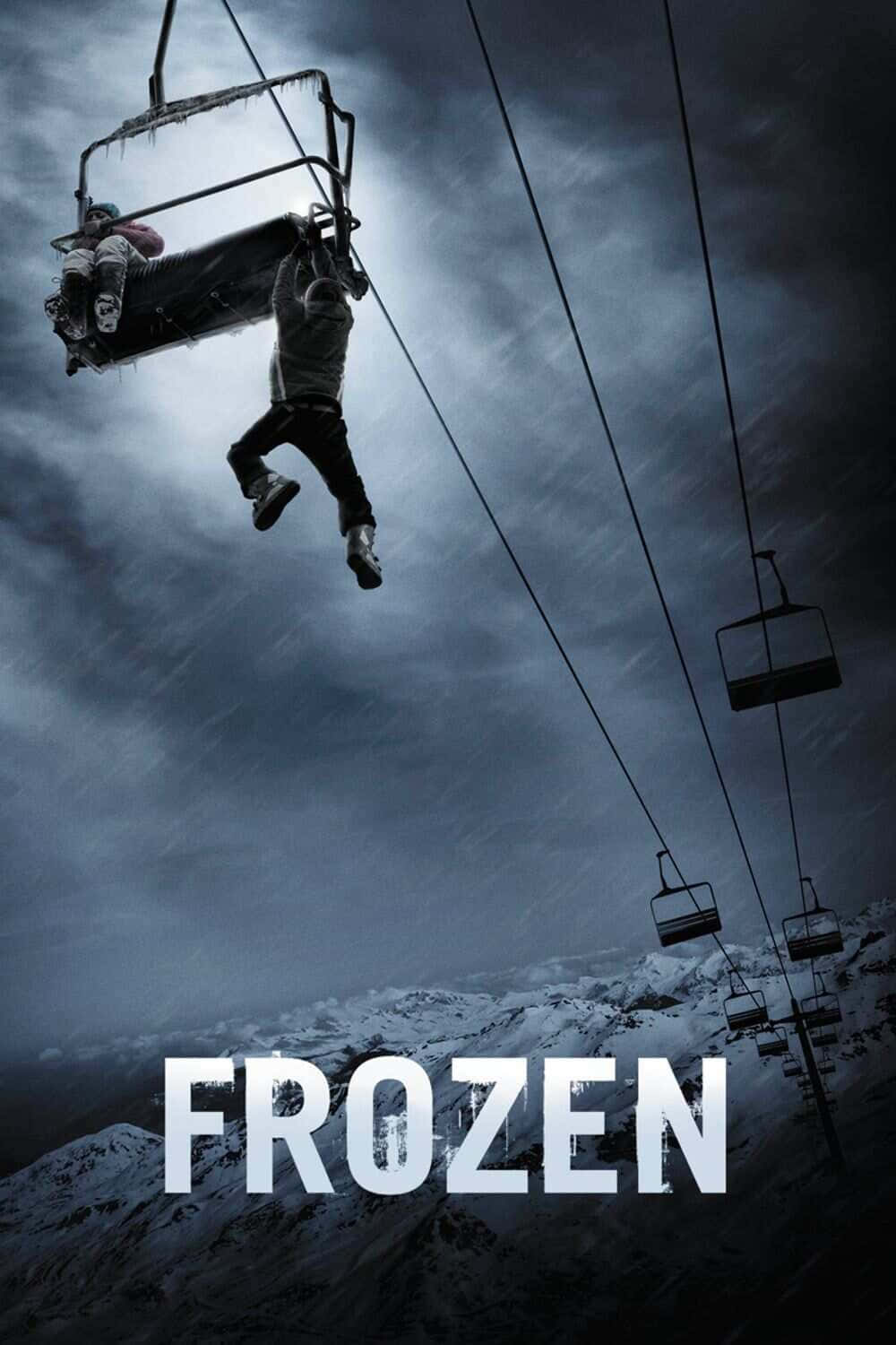 冰雪奇緣 桌布 壁紙 — 一名孤獨的滑雪者掛在結冰的滑雪纜車椅上，背景是暴風雨的山脈，下方是白雪覆蓋的山峰。
