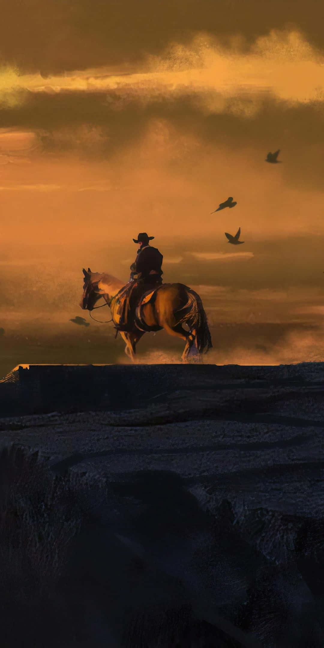 Red Dead Redemtion 2 桌布 壁紙 — 一名孤獨的牛仔騎著馬，在日落時分站在懸崖頂上，鳥兒在金色的天空中飛翔。