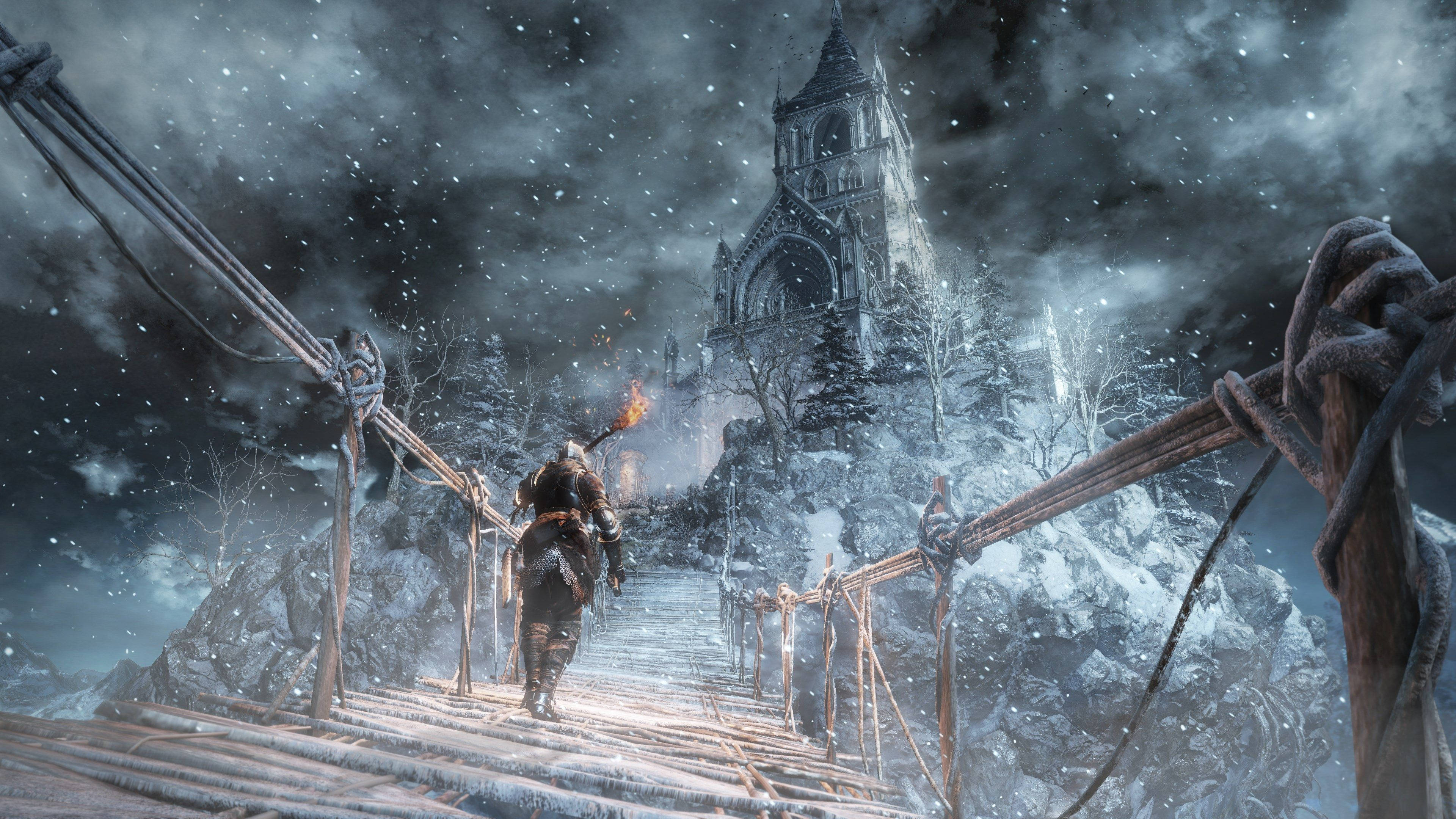dark souls 4K 桌布 壁紙 — 一名孤獨的裝甲戰士在風雨交加的夜空下，走在一條積雪的繩索橋上，朝著一座哥德式大教堂前進。