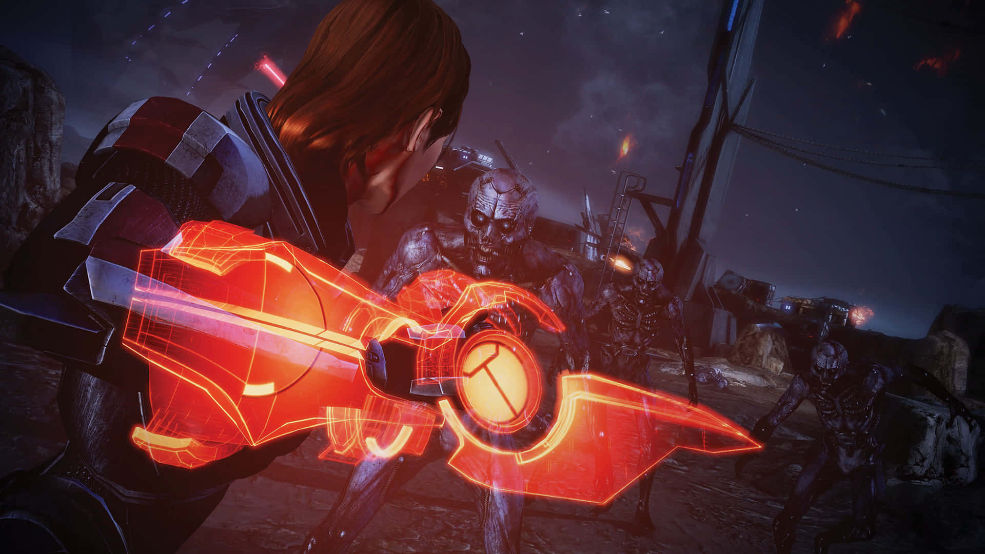 Mass Effect Legendary Edition 桌布 壁紙 — 一名戰士在星空下的黑暗科幻戰場上揮舞發光的紅色能量劍對抗骷髏敵人。