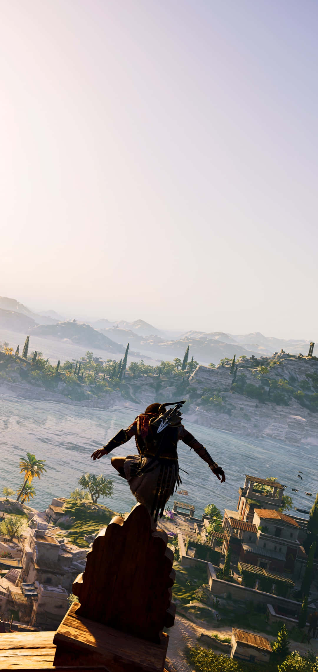 Android Assassin's Creed Odyssey 桌布 壁紙 — 一名戴兜帽的刺客從屋頂躍下，俯瞰陽光普照的地中海沿岸小鎮，有柏樹和遠山。