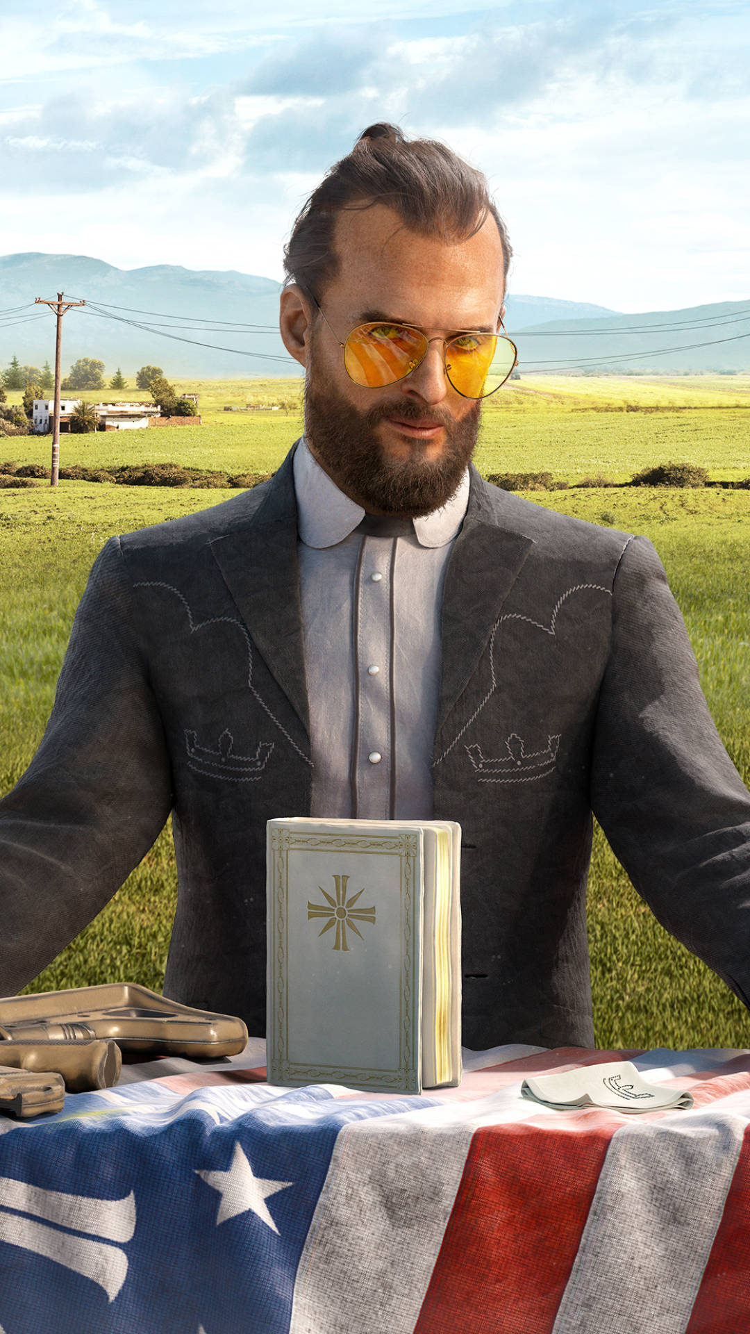 far cry 5 iPhone 桌布 壁紙 — 一名戴著神父領和太陽眼鏡的男子站在一張鋪有美國國旗的桌子後面，桌上放著聖經和槍枝。
