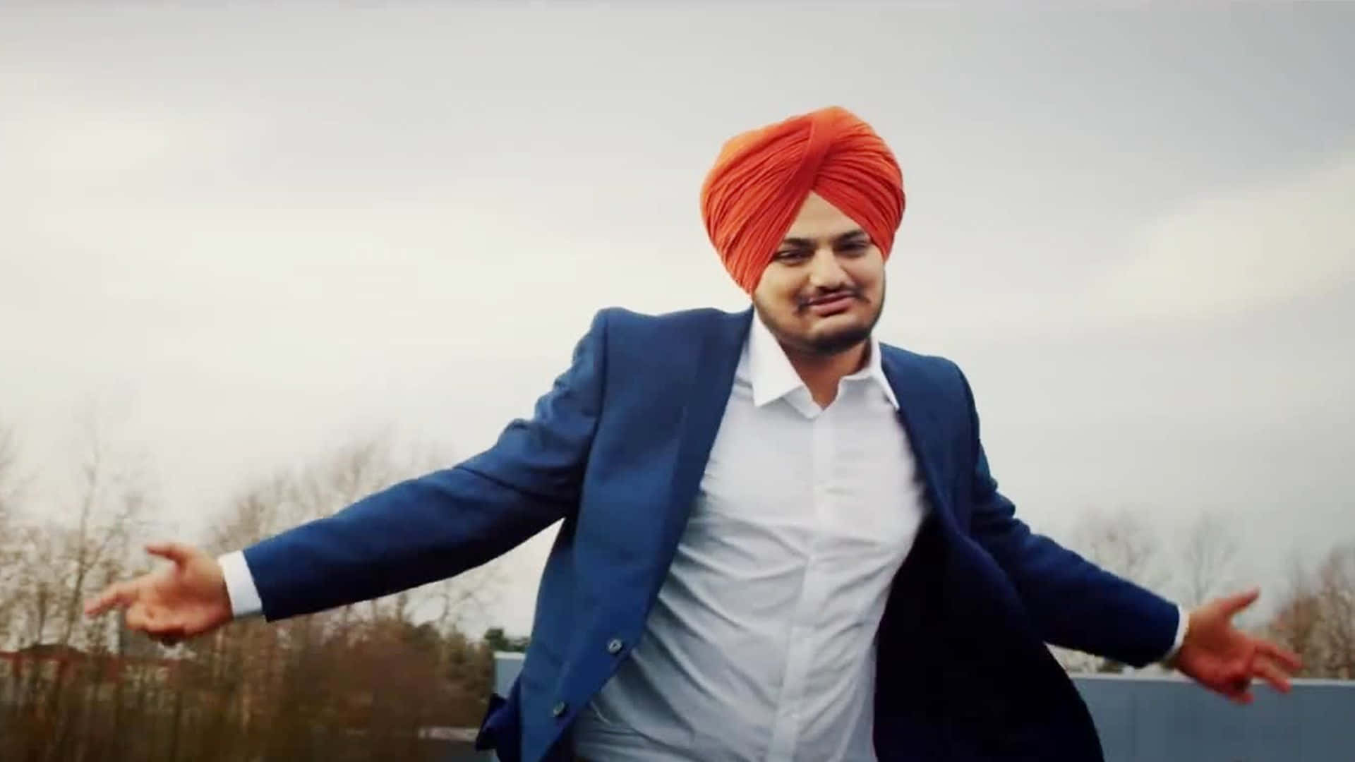 戴頭巾男子空中跳舞 — Sidhu Moose Wala 壁紙
