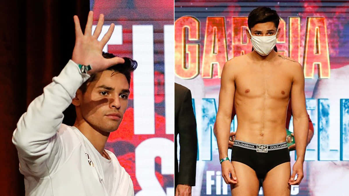 Ryan Garcia 桌布 壁紙 — 一名拳擊手身穿白色運動衫向粉絲揮手，另一名則赤裸上身穿著短褲站在發光標誌的稱重台上。