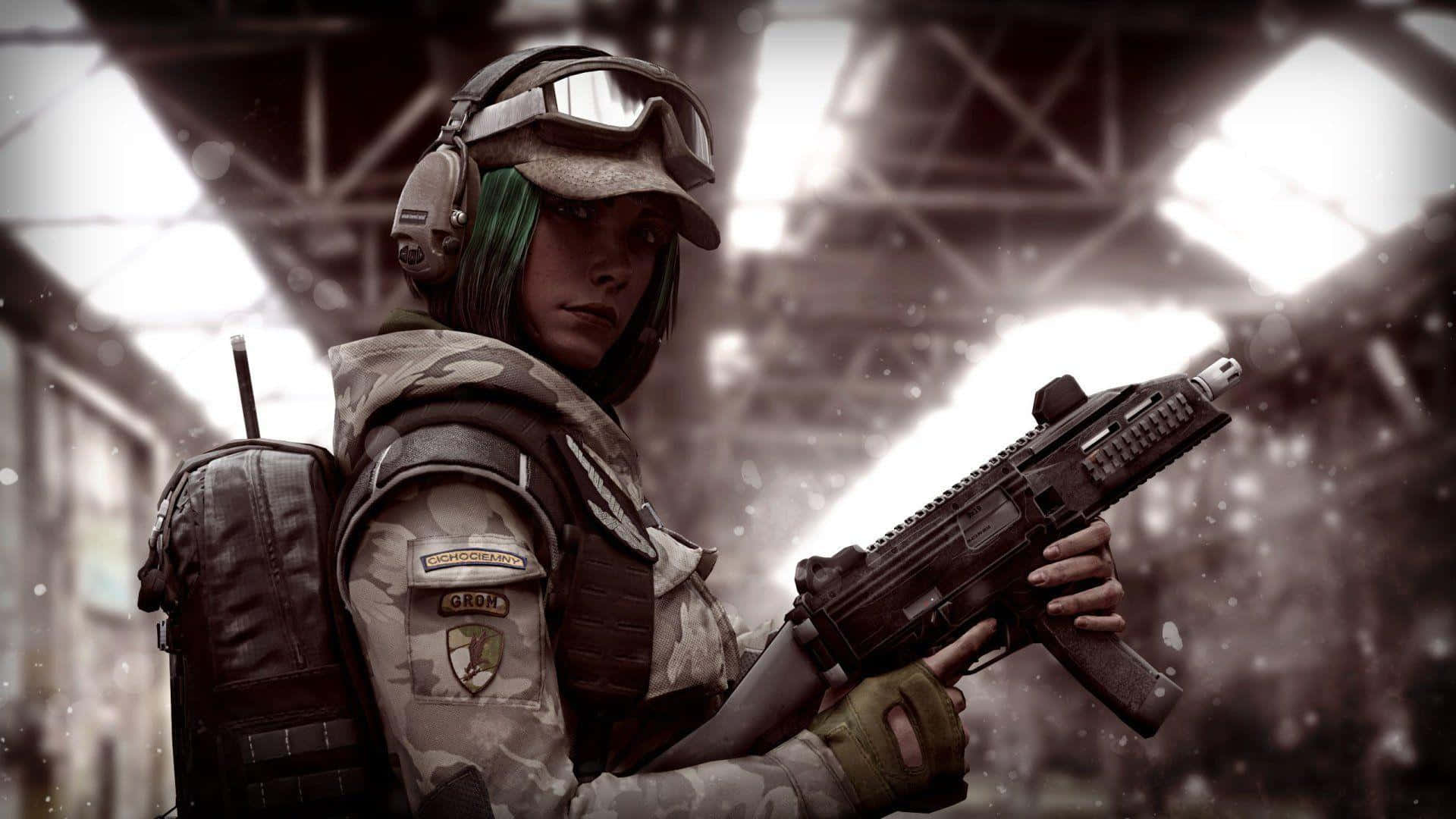 Ela R6 桌布 壁紙 — 一名擁有綠色頭髮和戰術裝備的士兵在光線昏暗的工業機庫內手持步槍。