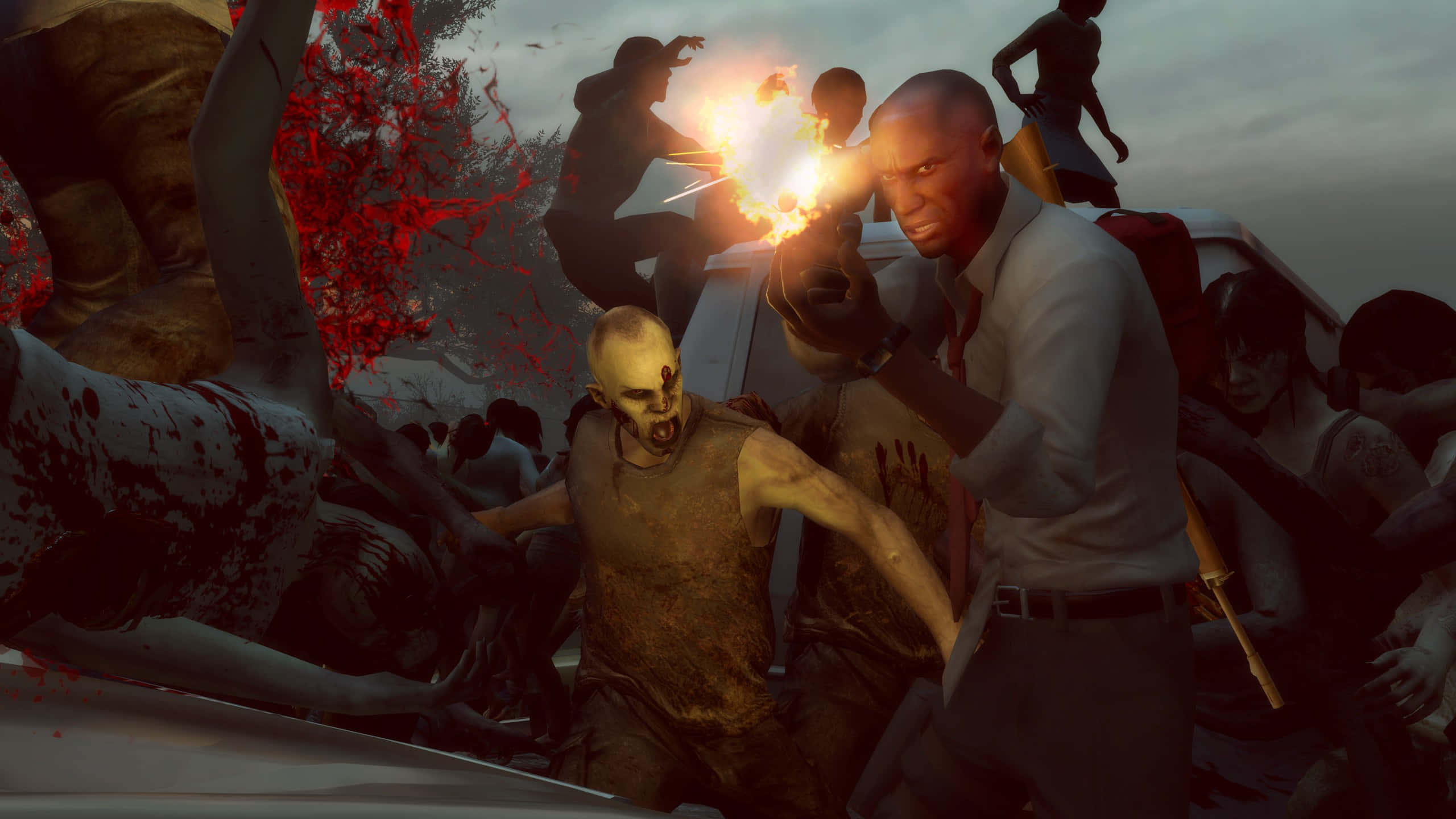 Left 4 Dead Characters 桌布 壁紙 — 一名男子向一群包圍汽車的殭屍開火，血跡四濺，槍口閃爍著火焰。