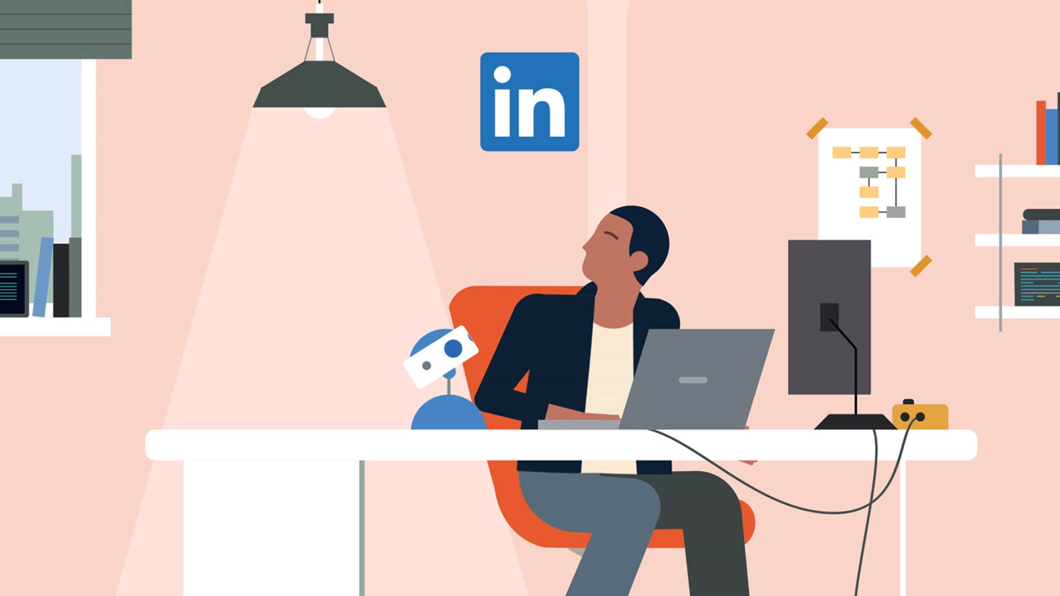 Linkedin 桌布 壁紙 — 一名男子在現代辦公室中坐在辦公桌前，桌上放著筆記型電腦和機器人助手，上方有一盞吊燈。