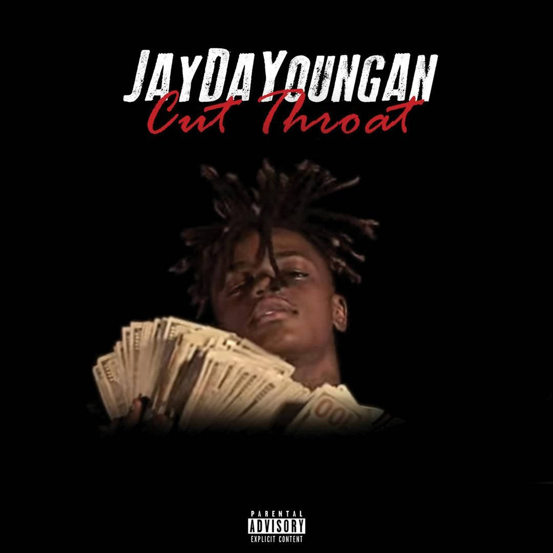 Jaydayoungan 桌布 壁紙 — 一名留著辮子頭的年輕男子在戲劇性燈光下，於黑色背景前手持展開的現金。