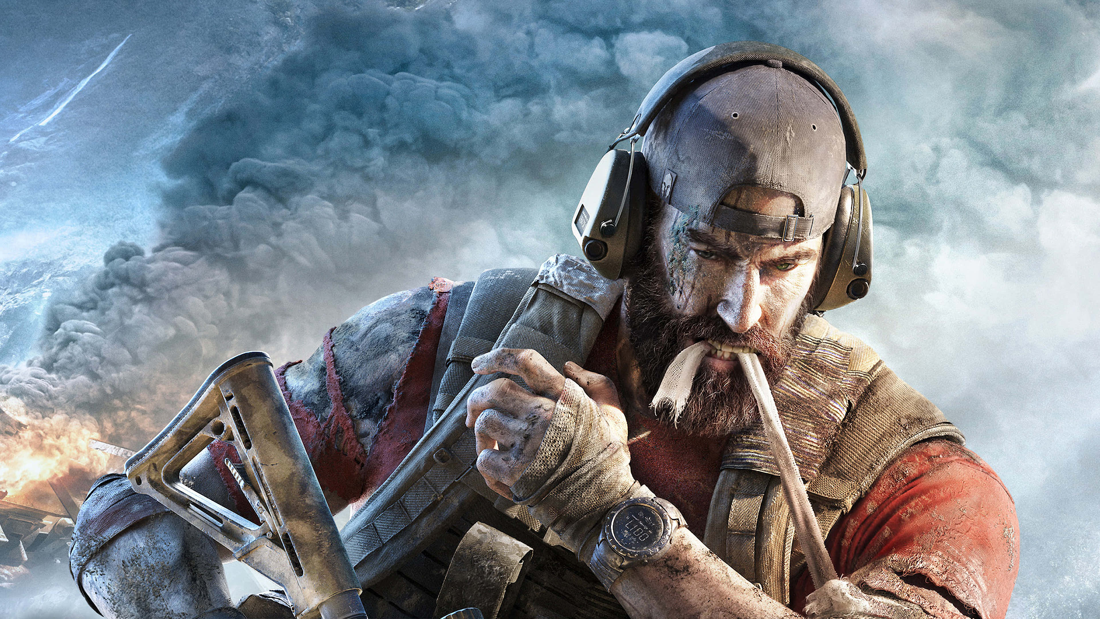 Ghost Recon 桌布 壁紙 — 一名留鬍鬚、戴耳機的粗獷士兵，在煙霧和火焰瀰漫的戰爭廢墟戰場上緊握步槍。