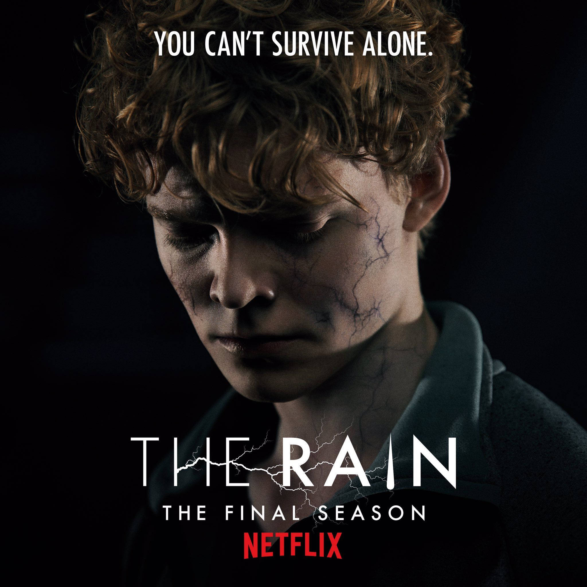Netflix 桌布 壁紙 — 一名皮膚龜裂、捲髮的年輕男子在標題帶有閃電的黑暗背景下向下凝視。
